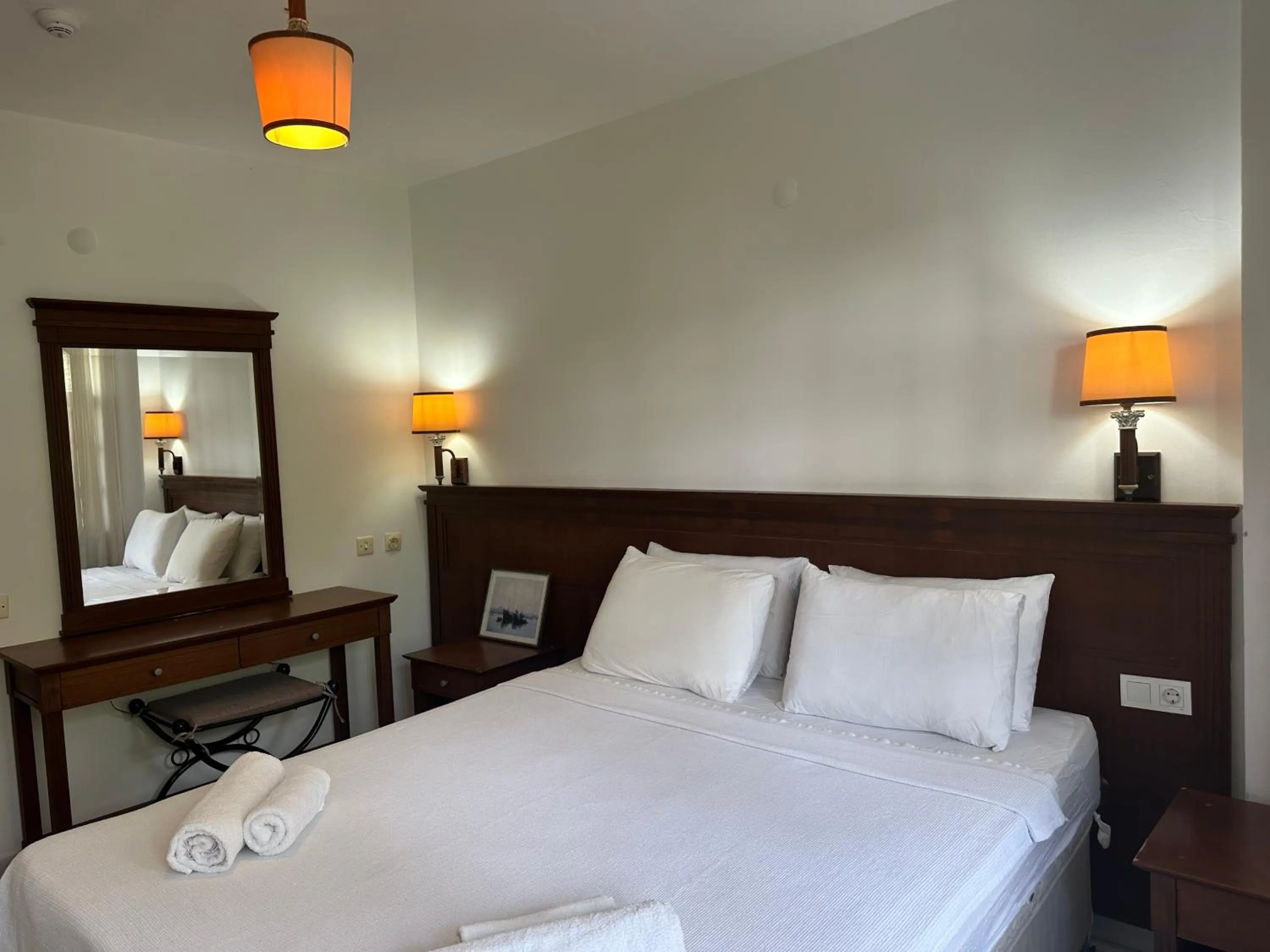 Bed in NATURELLA APART HOTEL