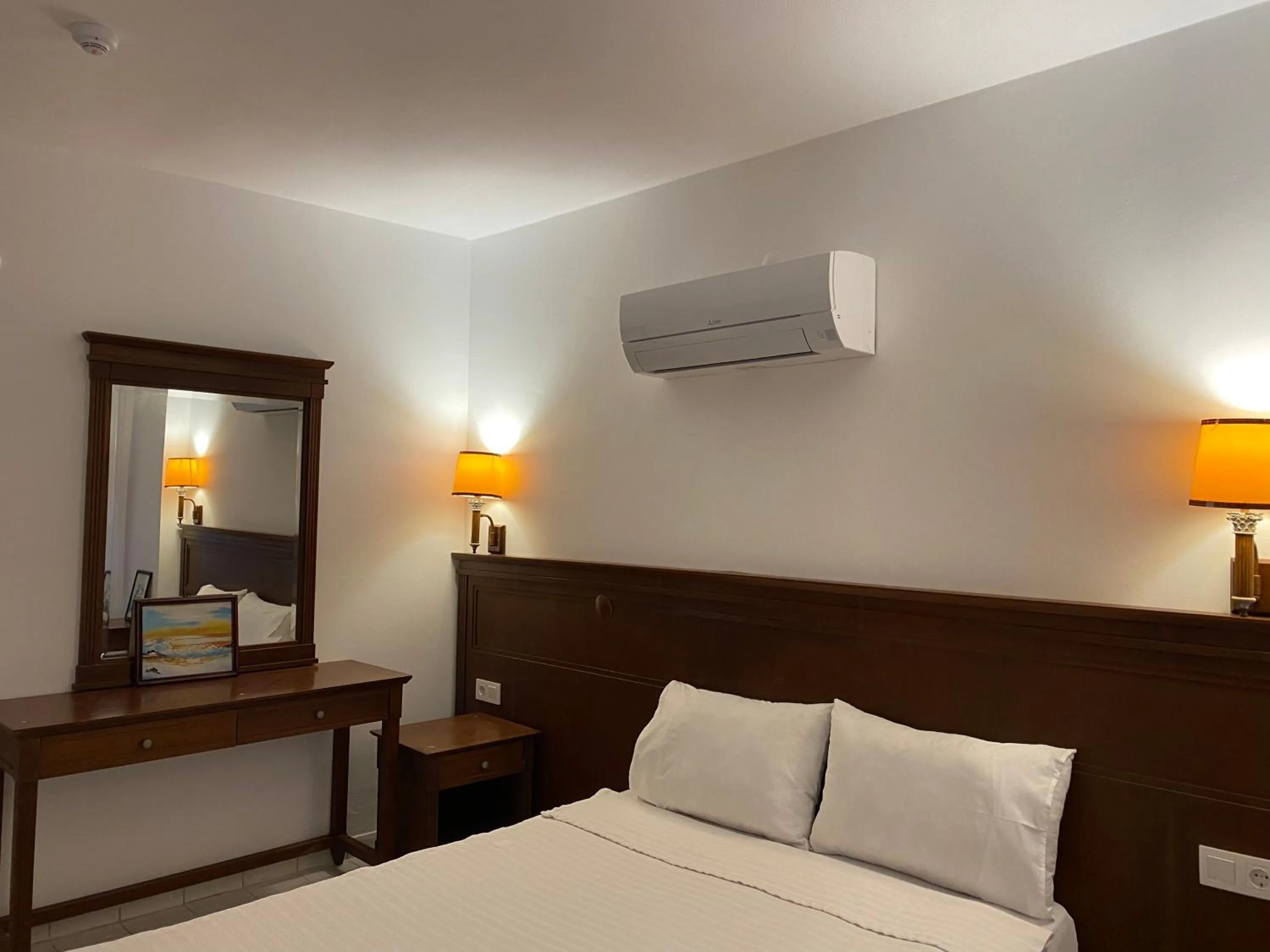 Bed in NATURELLA APART HOTEL