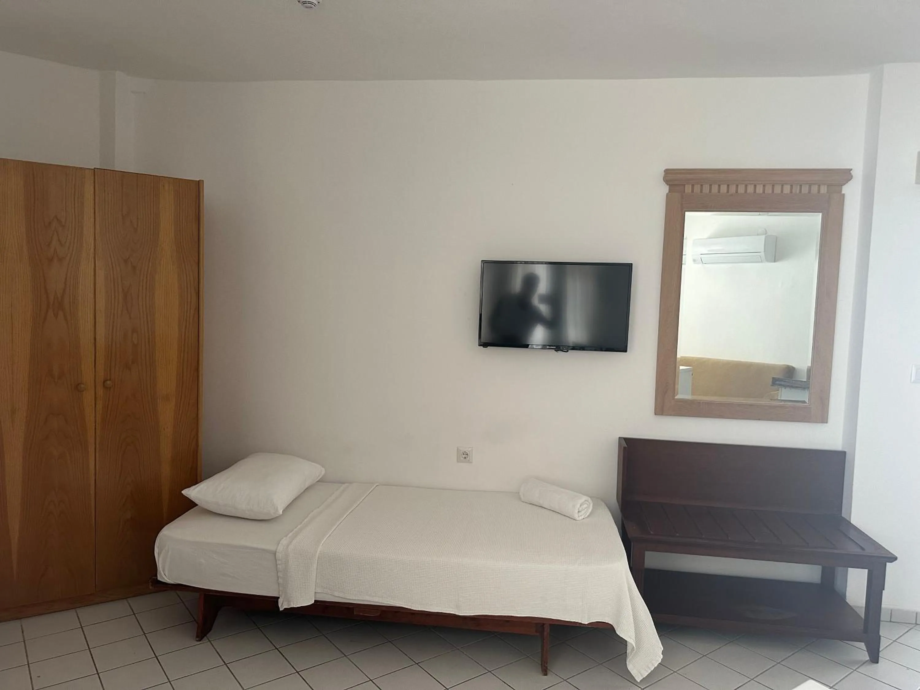 Bed in NATURELLA APART HOTEL