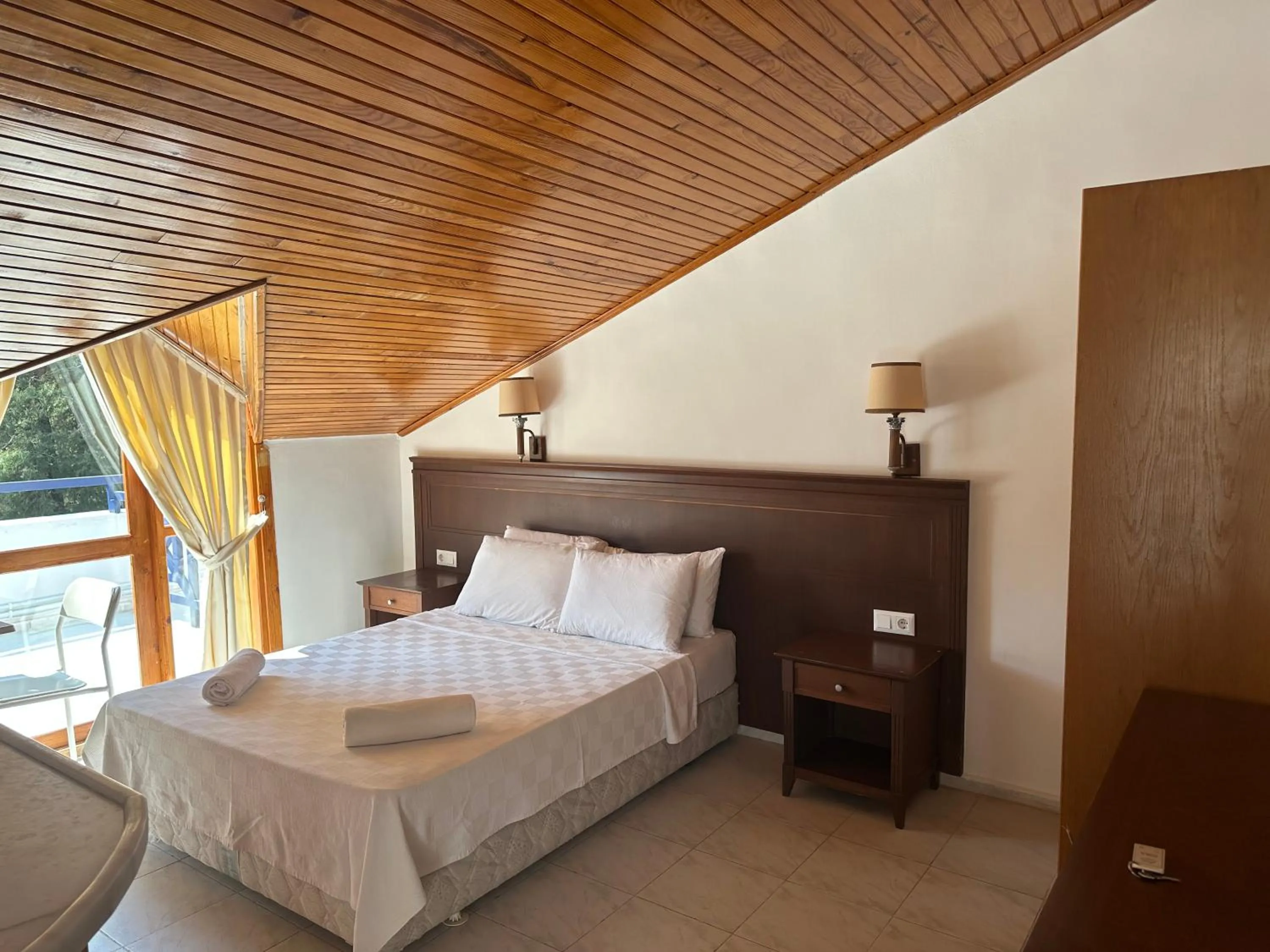 Bed in NATURELLA APART HOTEL