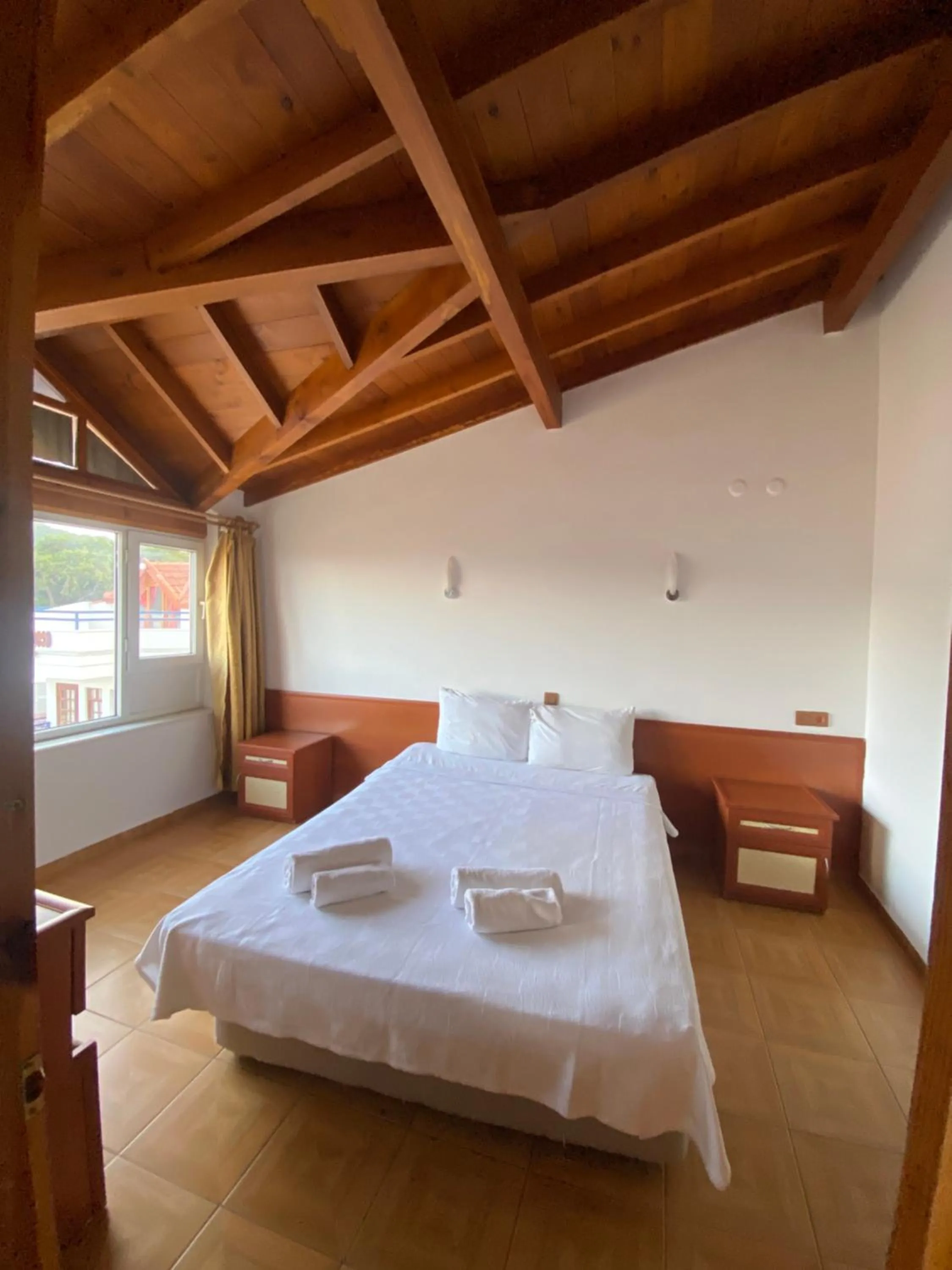 Bed in NATURELLA APART HOTEL