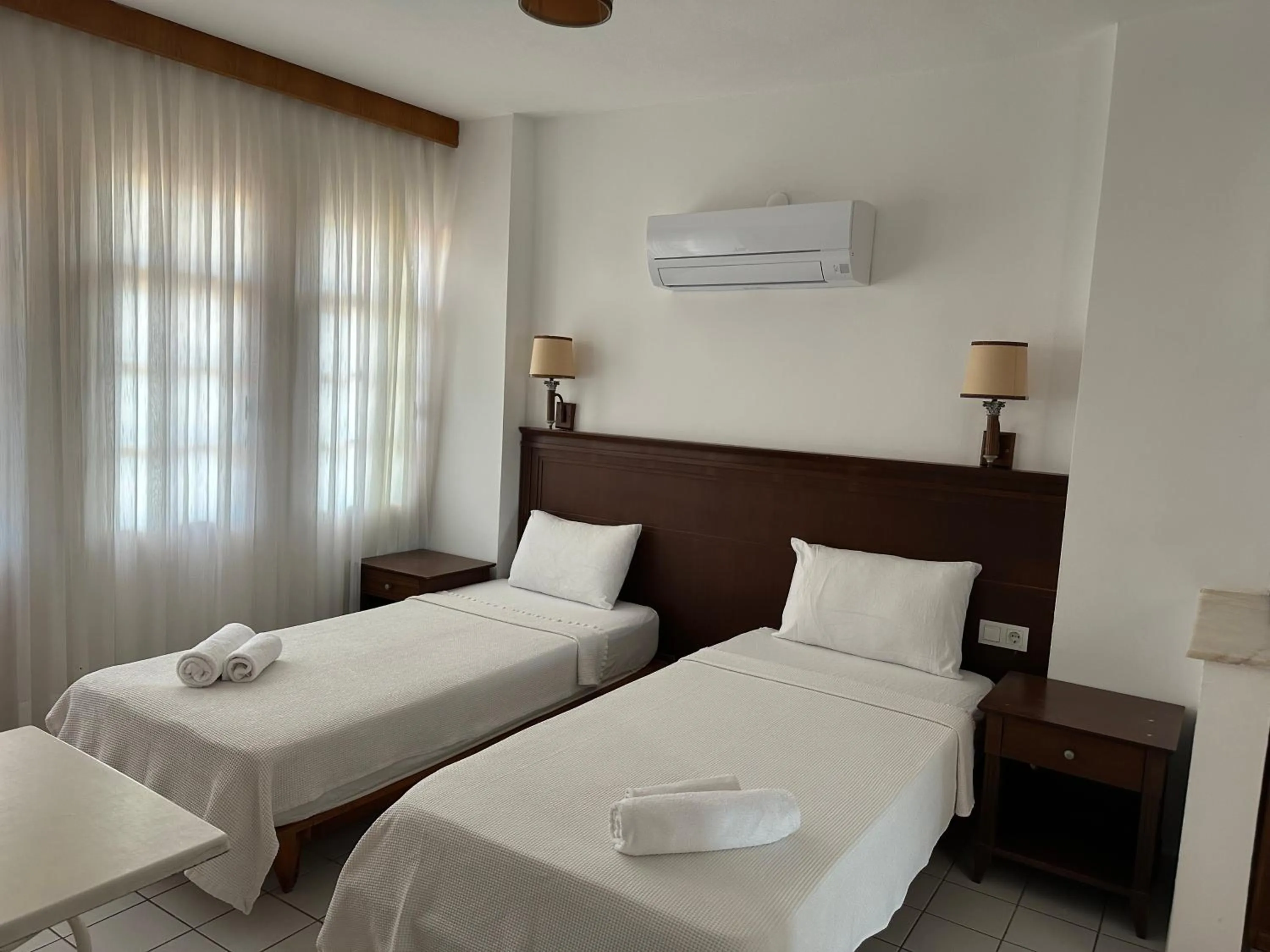 Bed in NATURELLA APART HOTEL