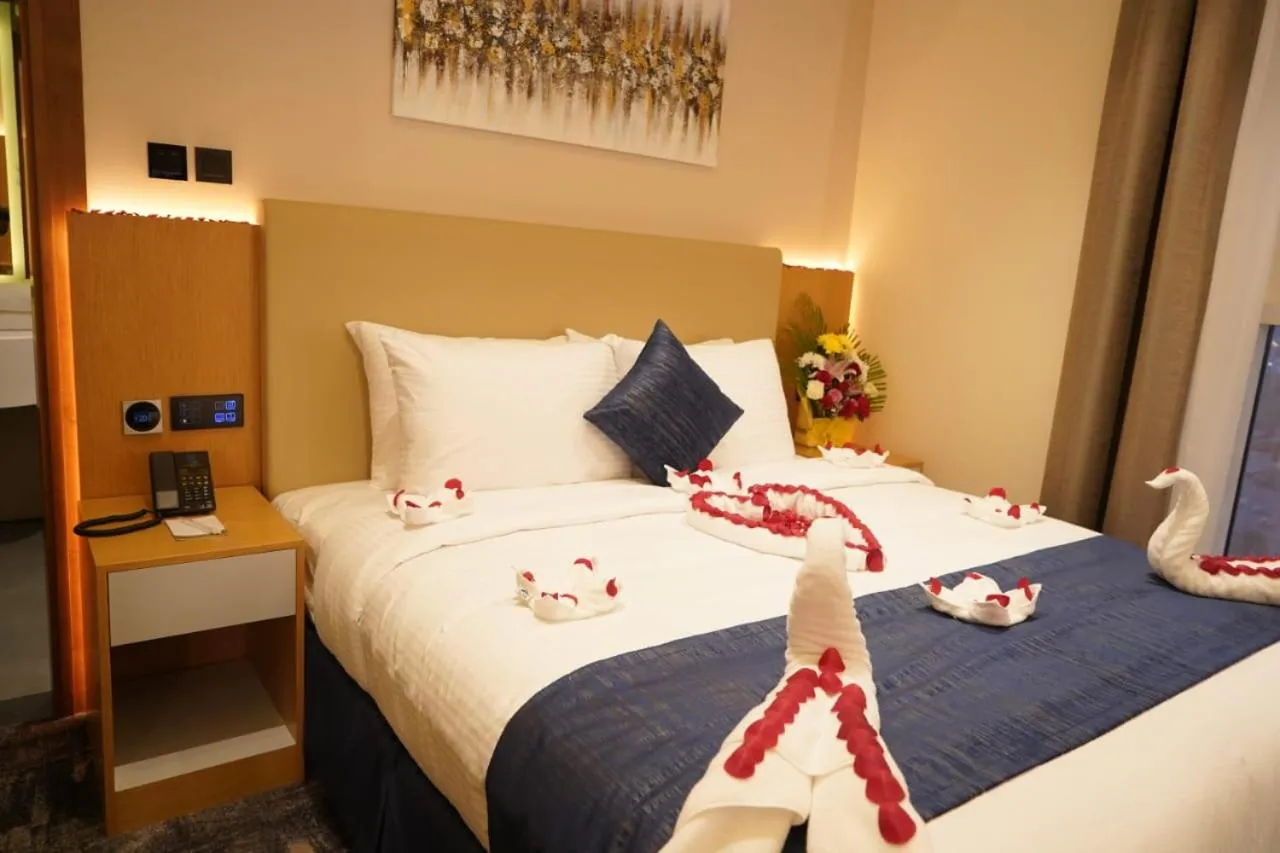 Bed in AL HAYAT HOTEL