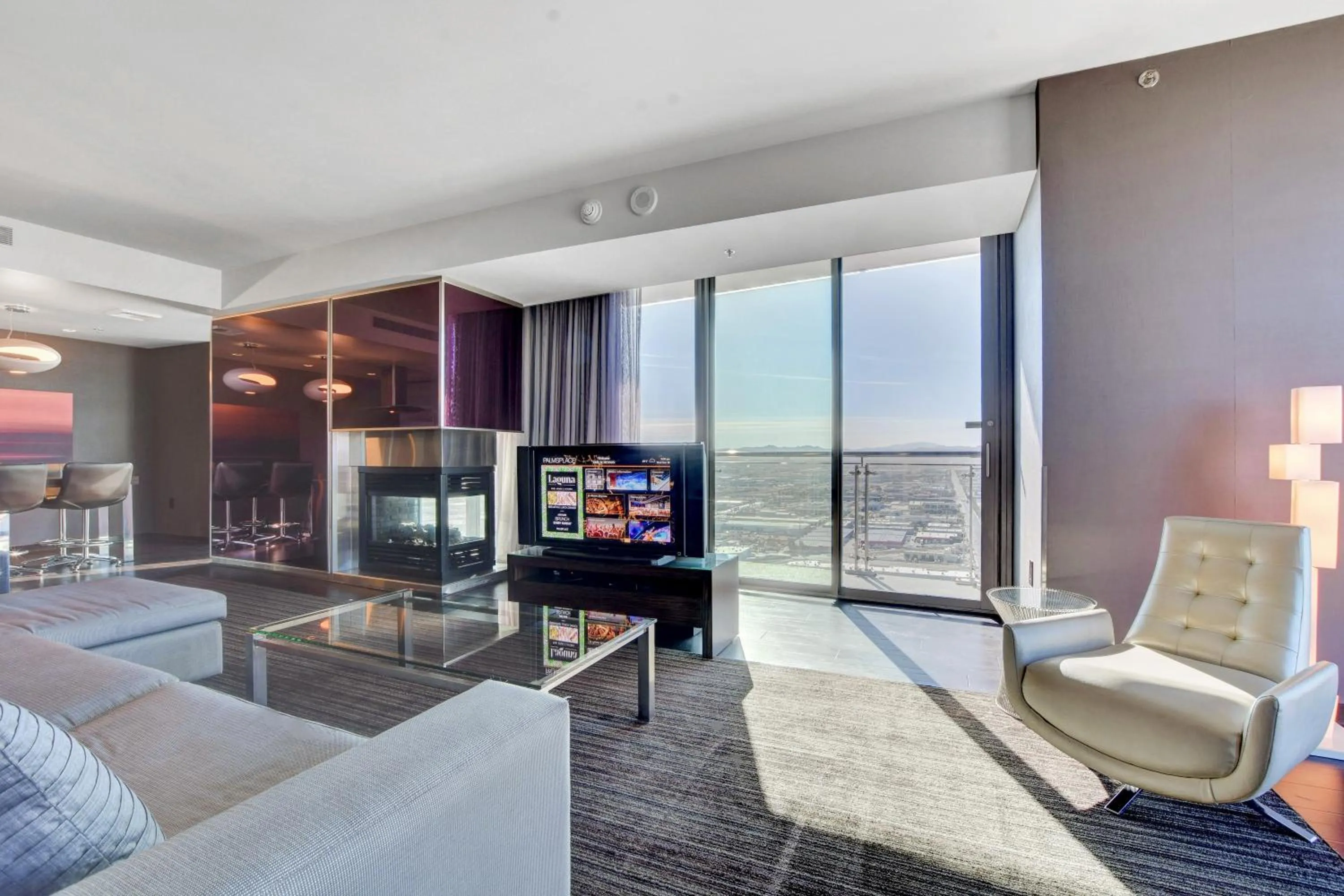 Communal lounge/ TV room in Private Luxury Panoramic Suite at Palms Place