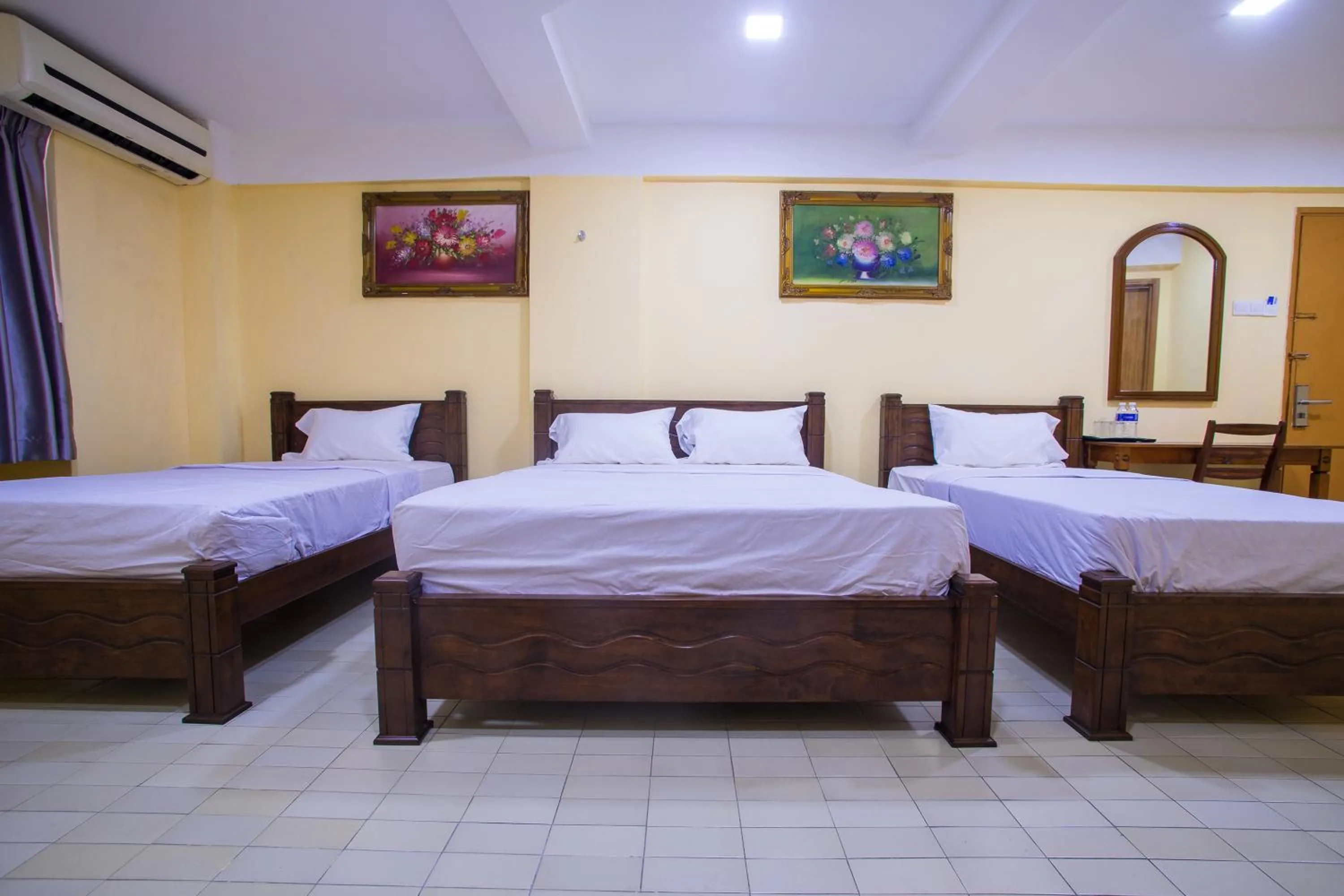 Bed in MK Inn Hotel
