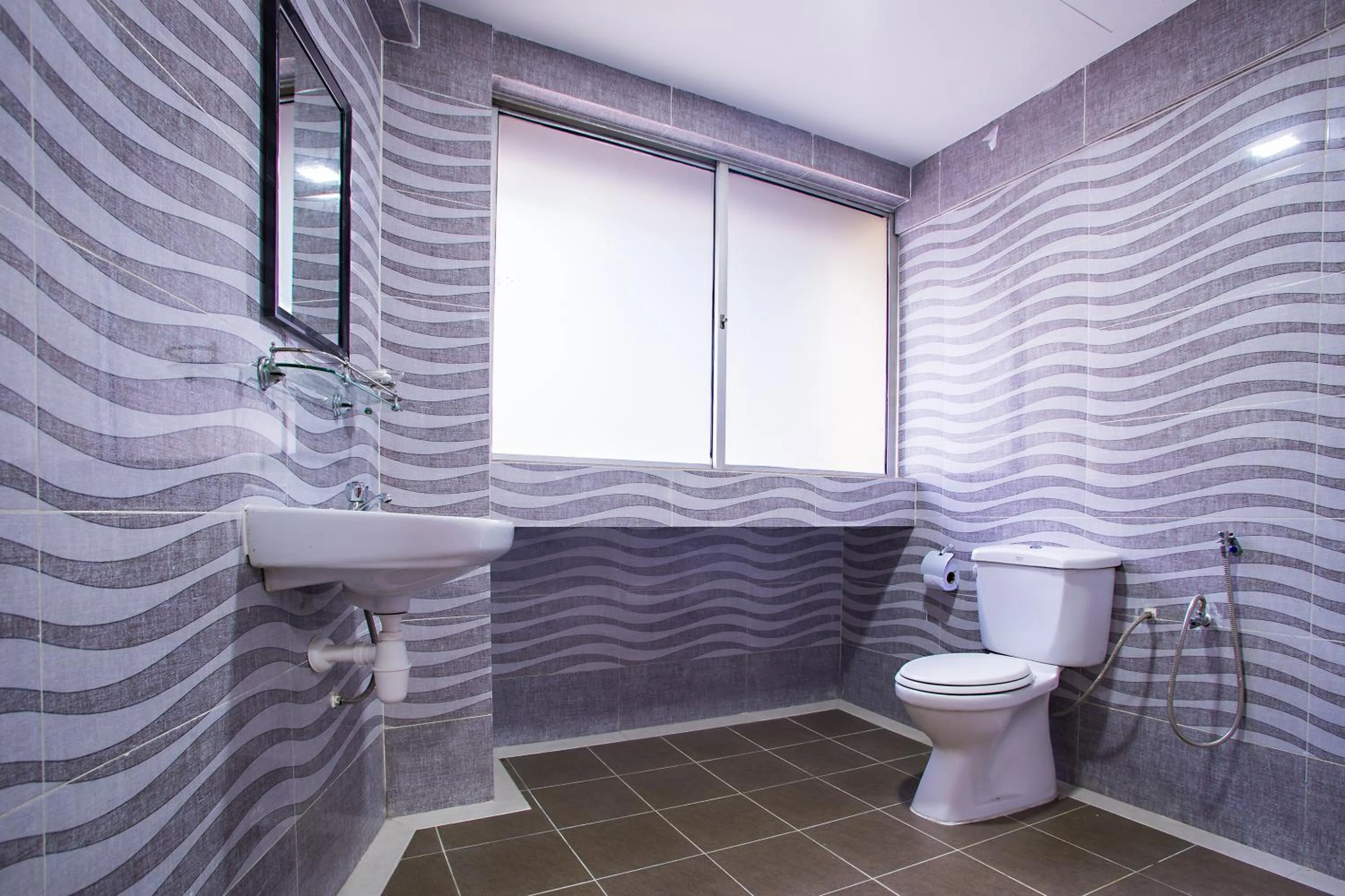 Bathroom in MK Inn Hotel