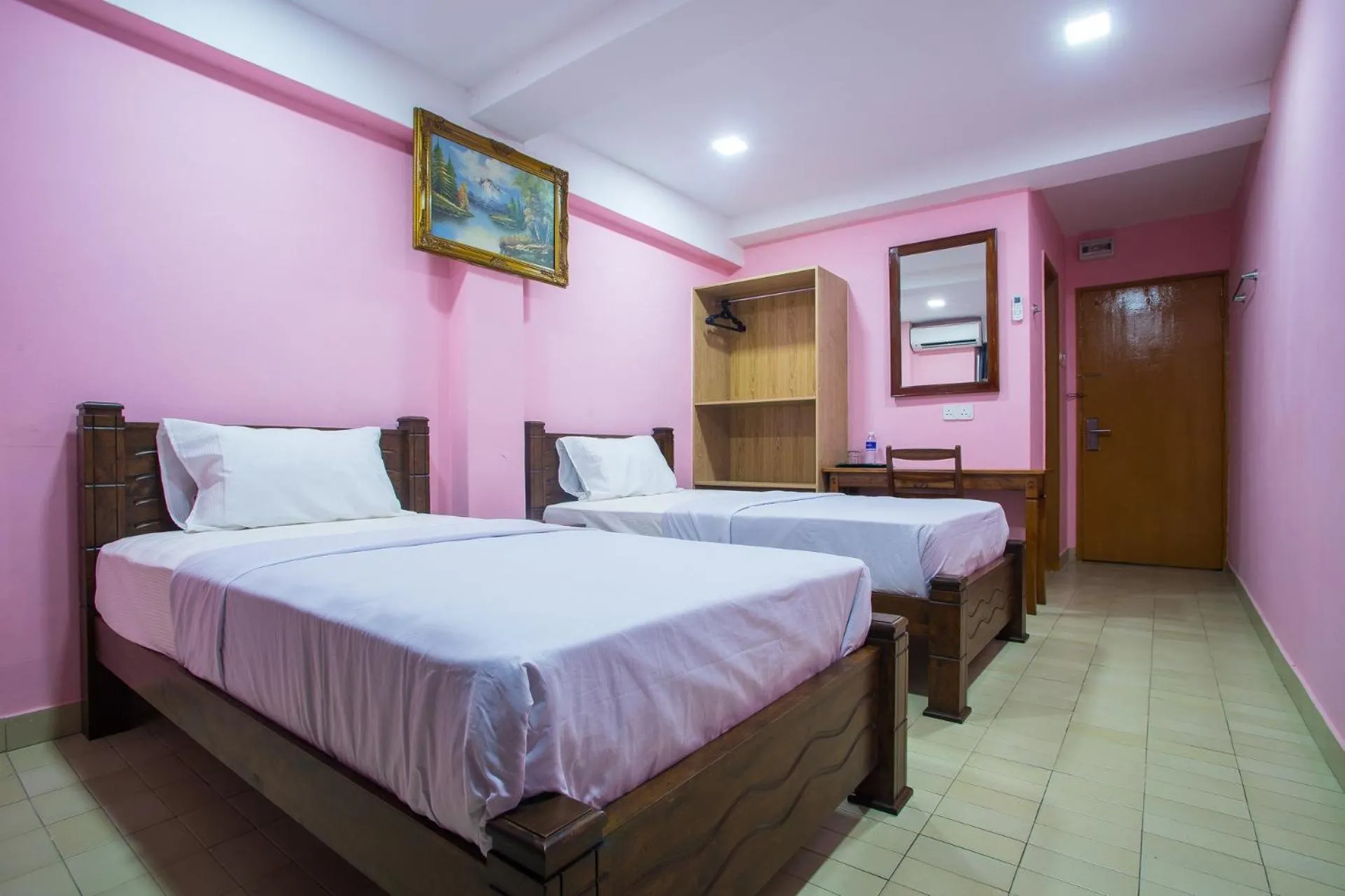 Bed in MK Inn Hotel