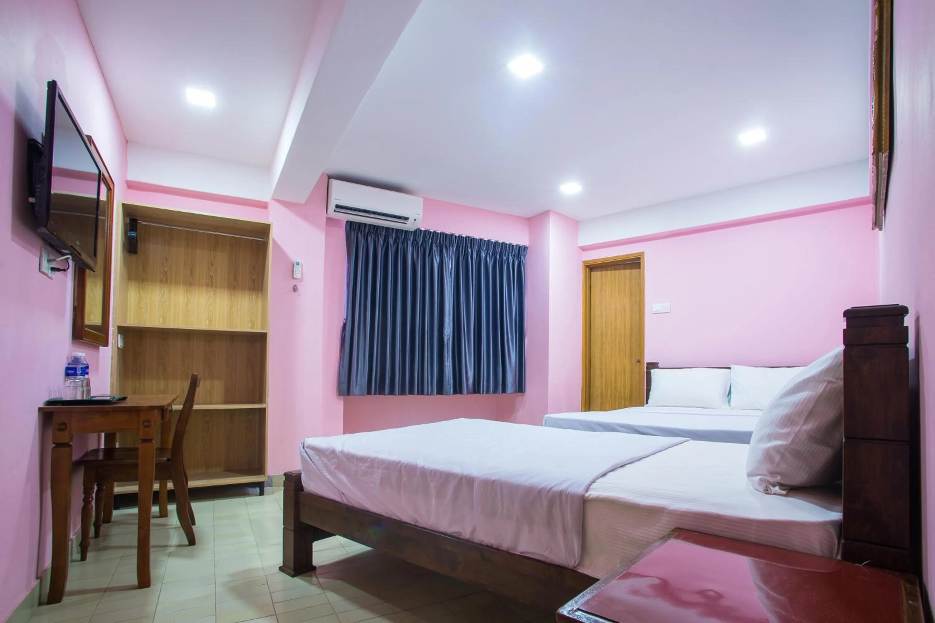 Bed in MK Inn Hotel