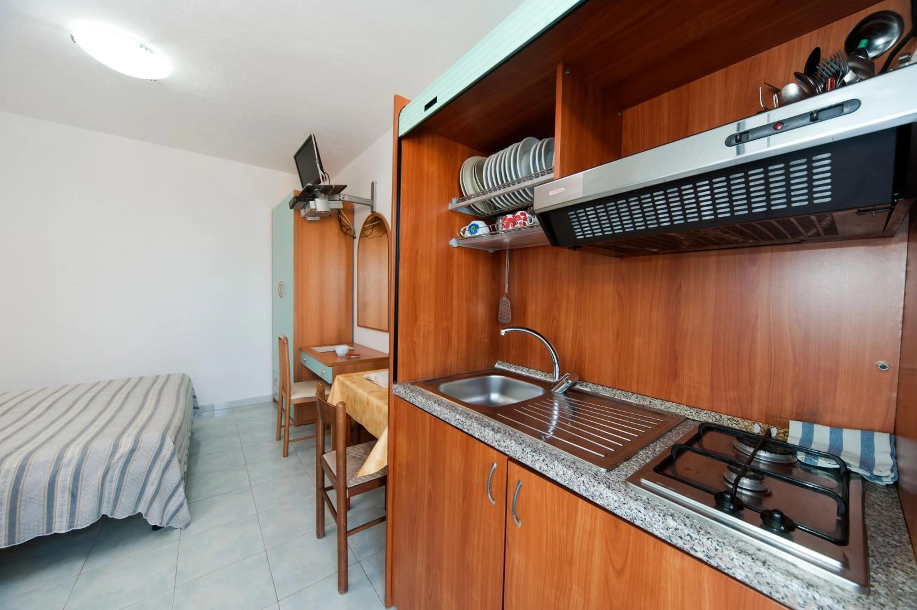Kitchen or kitchenette, Bed in Residence Hotel La Rotonda Sul Mare