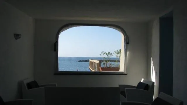 Communal lounge/ TV room in Residence Hotel La Rotonda Sul Mare