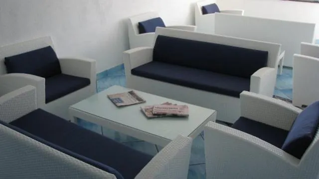 Communal lounge/ TV room in Residence Hotel La Rotonda Sul Mare