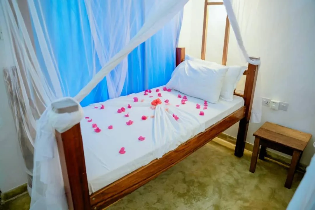 Bed in Serenity Boutique Hotel, Tanzania Unforgettable