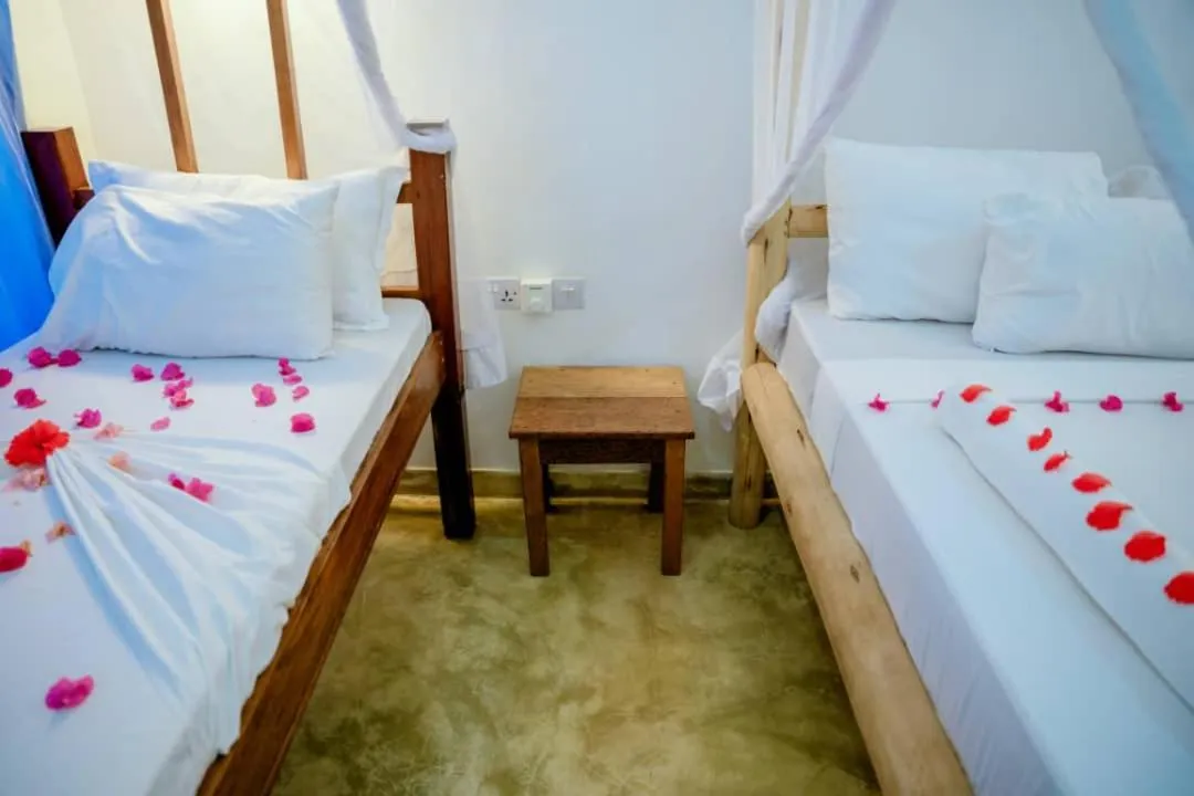 Bed in Serenity Boutique Hotel, Tanzania Unforgettable