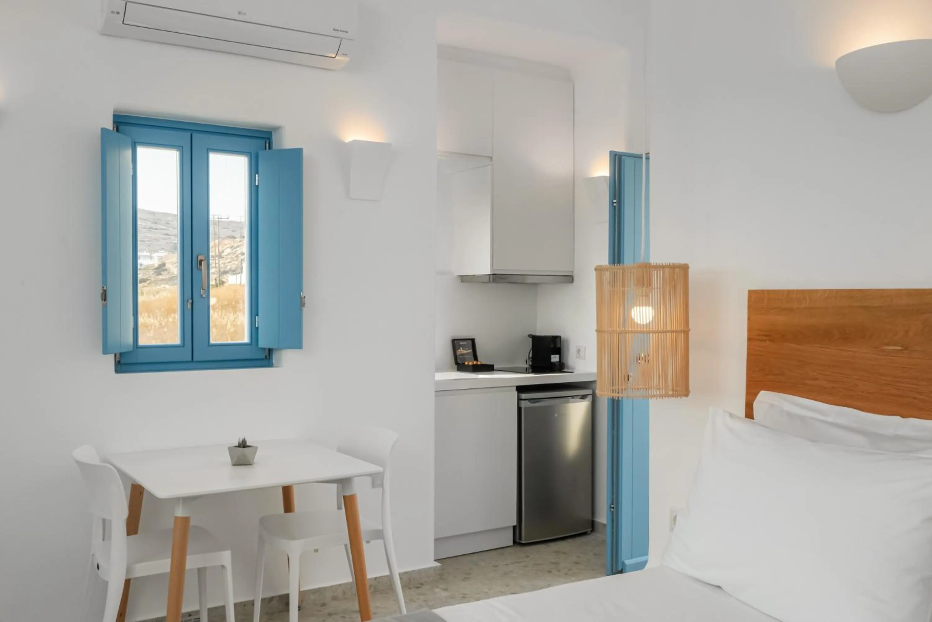 Seating area, Bed in Camvillia Donoussa Village Suites