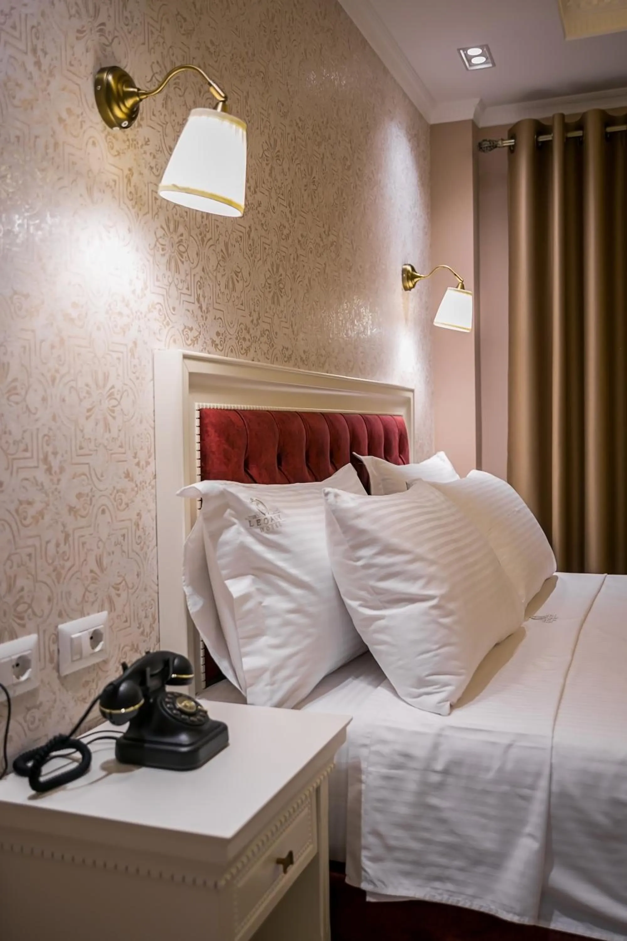 Bed in Legacy Boutique Hotel