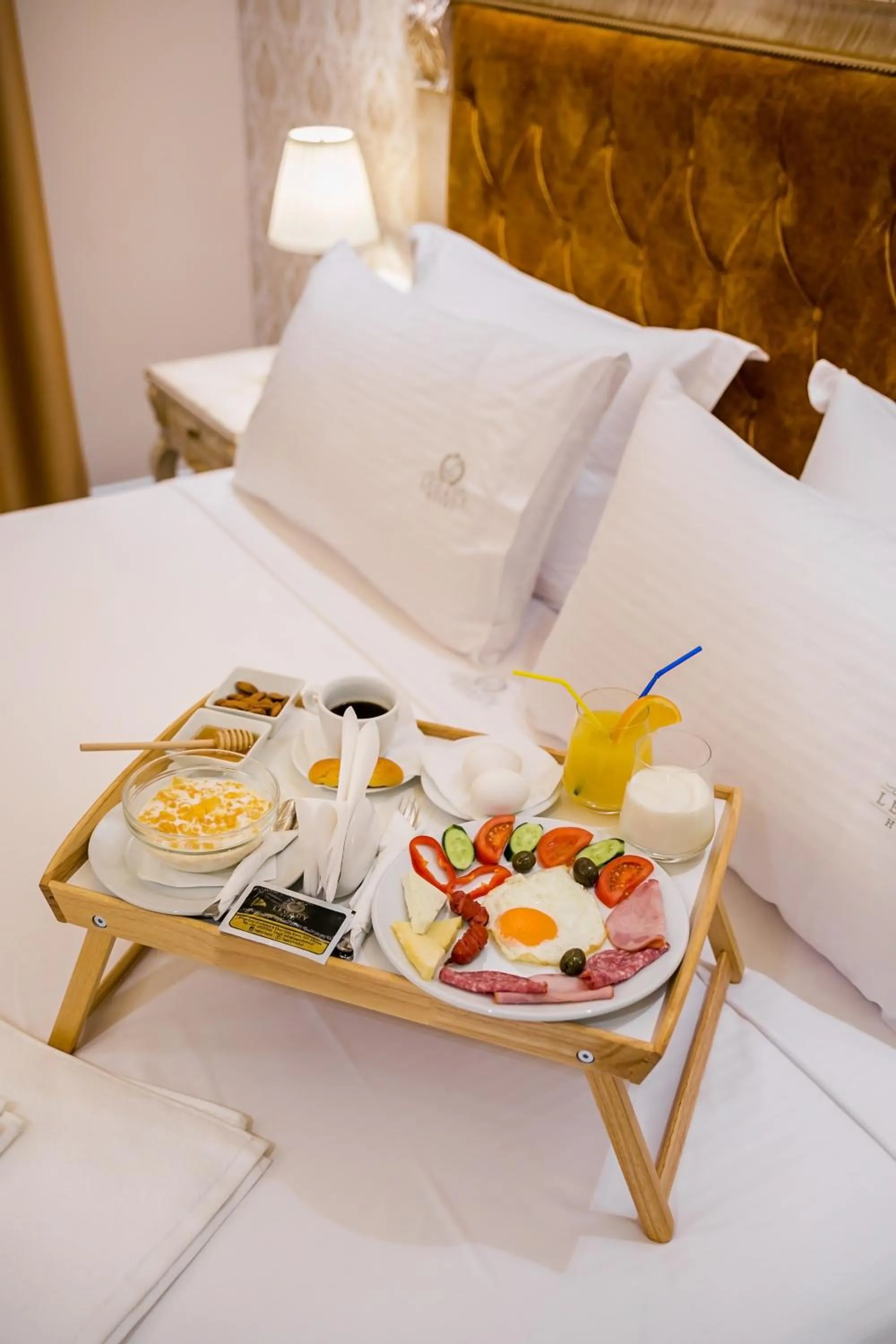 Bed in Legacy Boutique Hotel