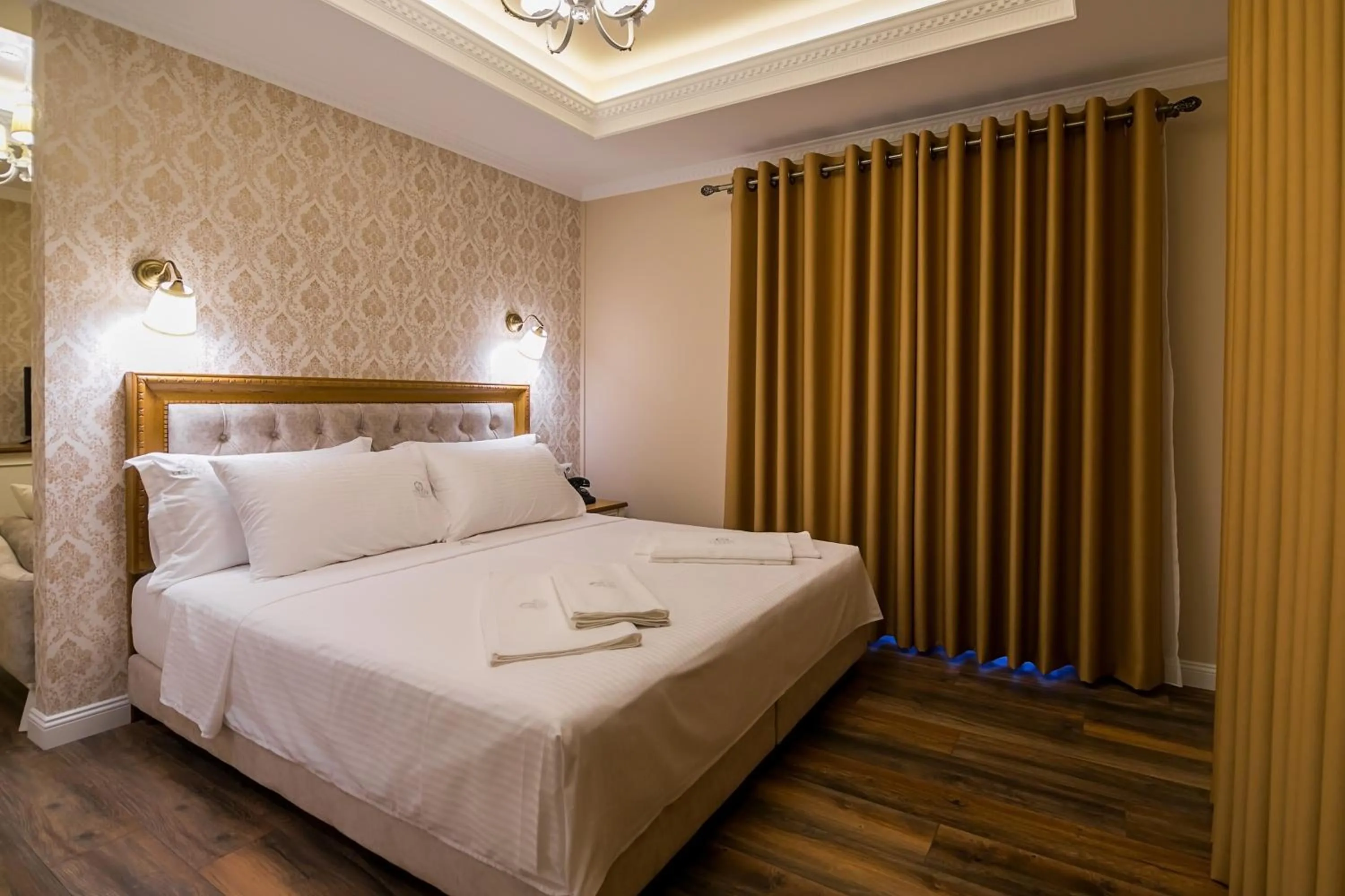 Bed in Legacy Boutique Hotel