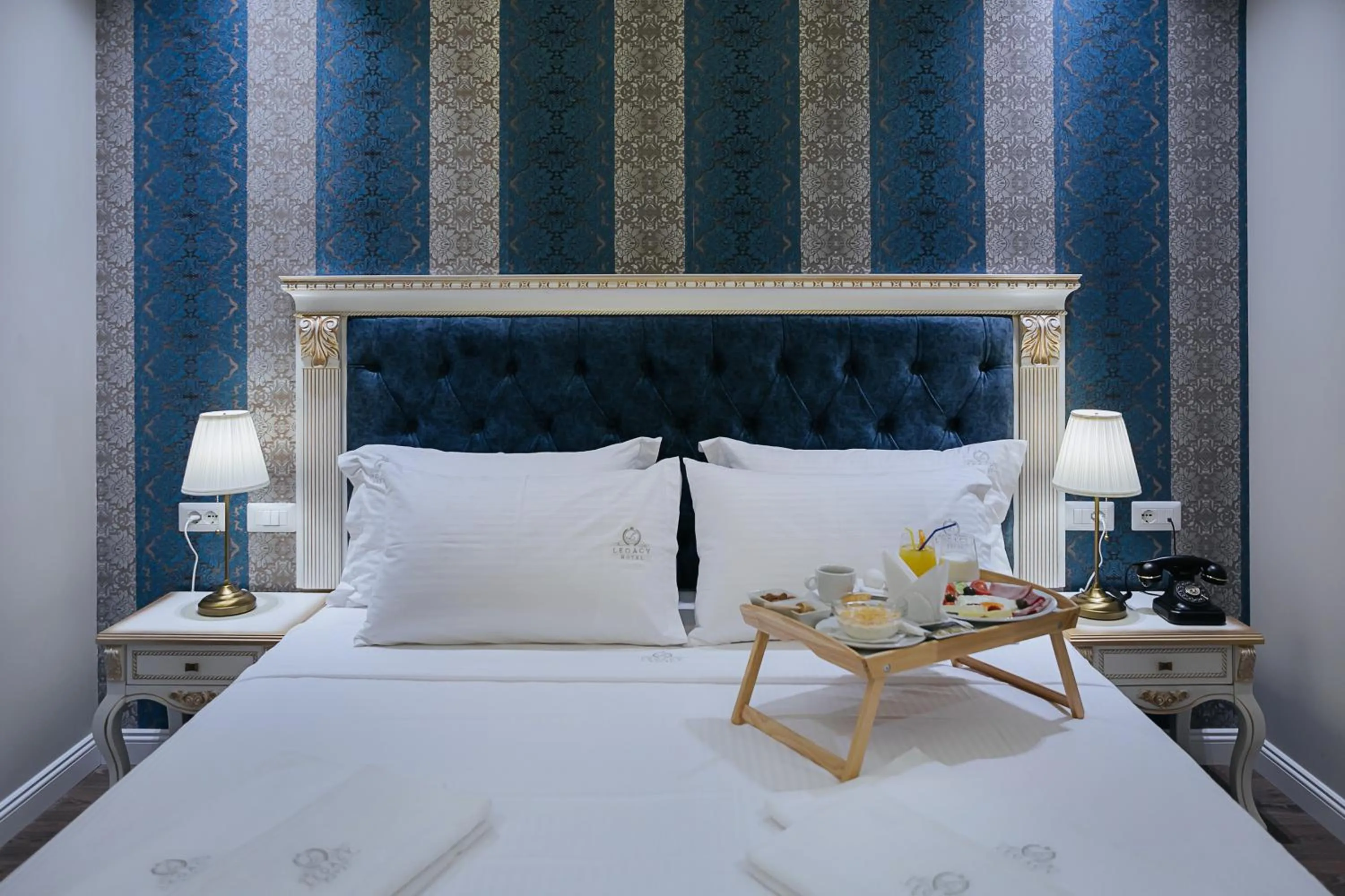 Bed in Legacy Boutique Hotel