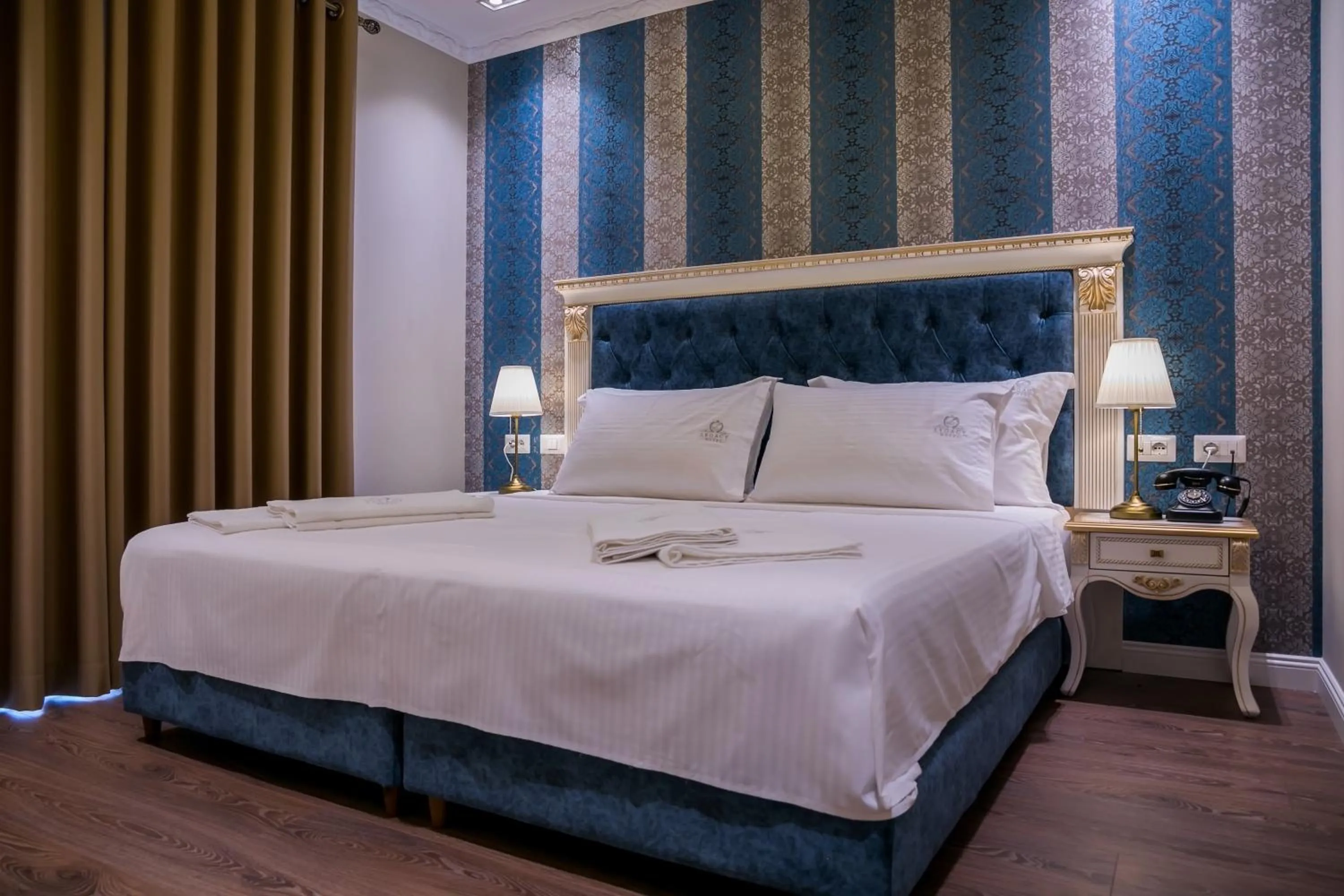 Bed in Legacy Boutique Hotel