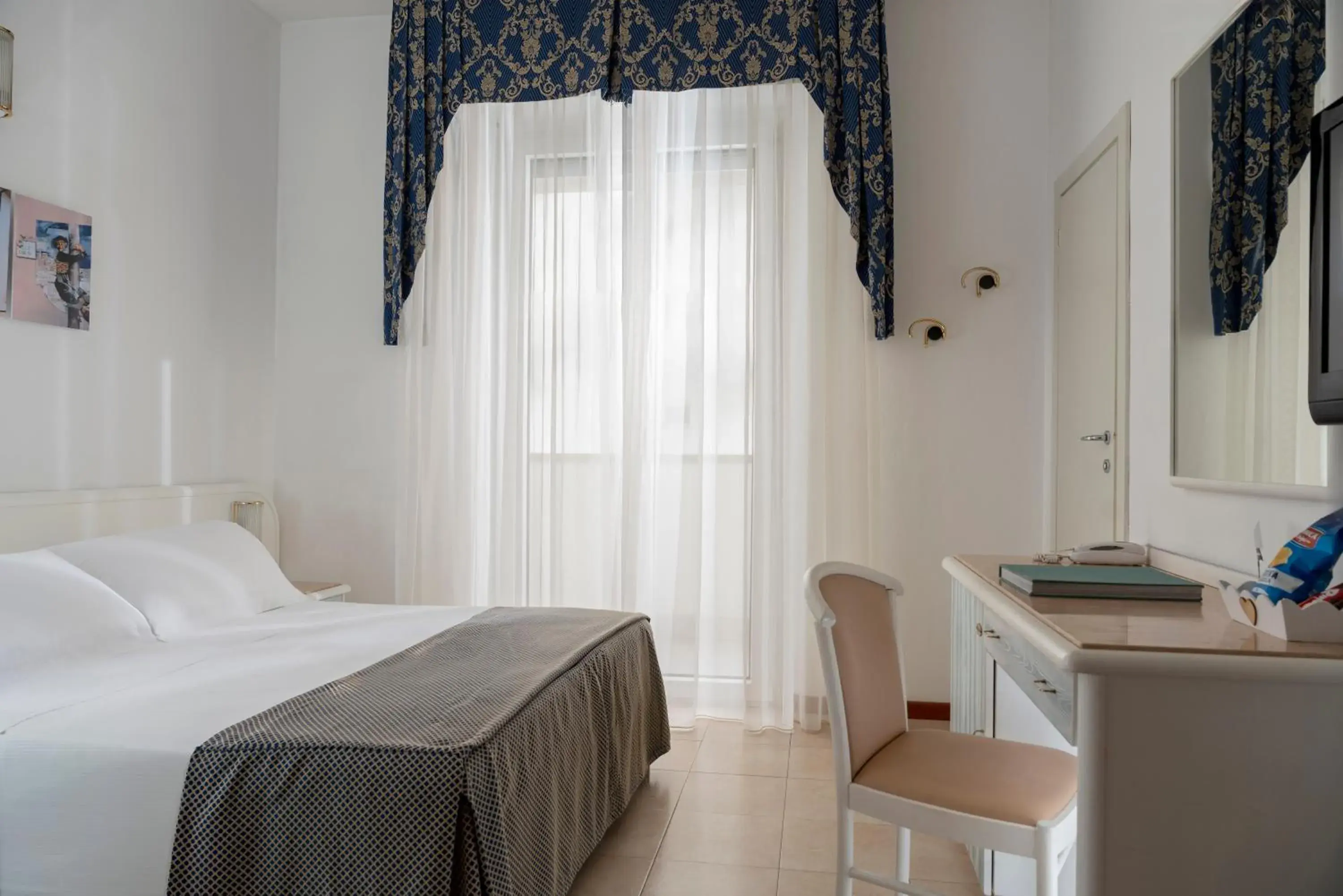 Bed in Hotel Du Soleil Bed in Hotel Du Soleil