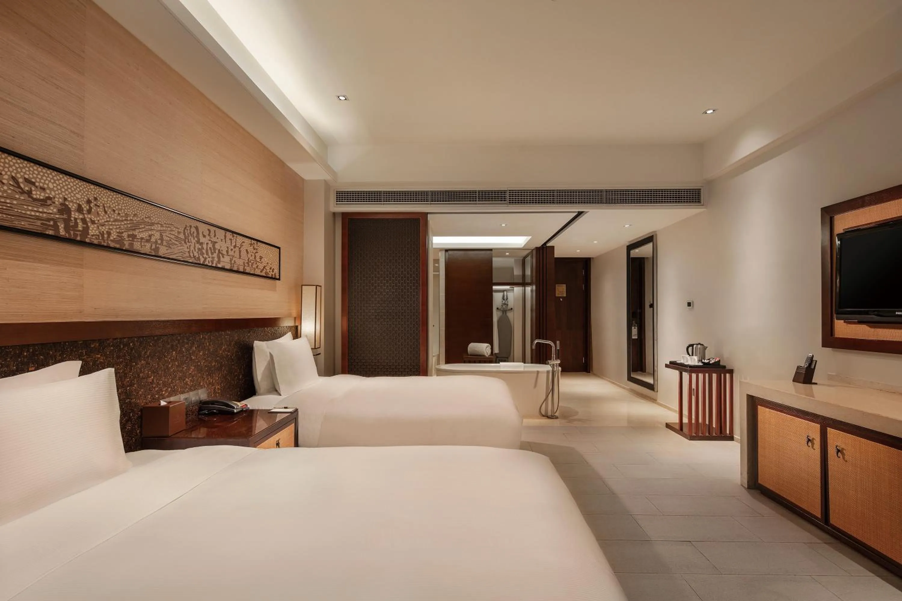Photo of the whole room, Bed in Wanda Realm Resort Sanya Haitang Bay