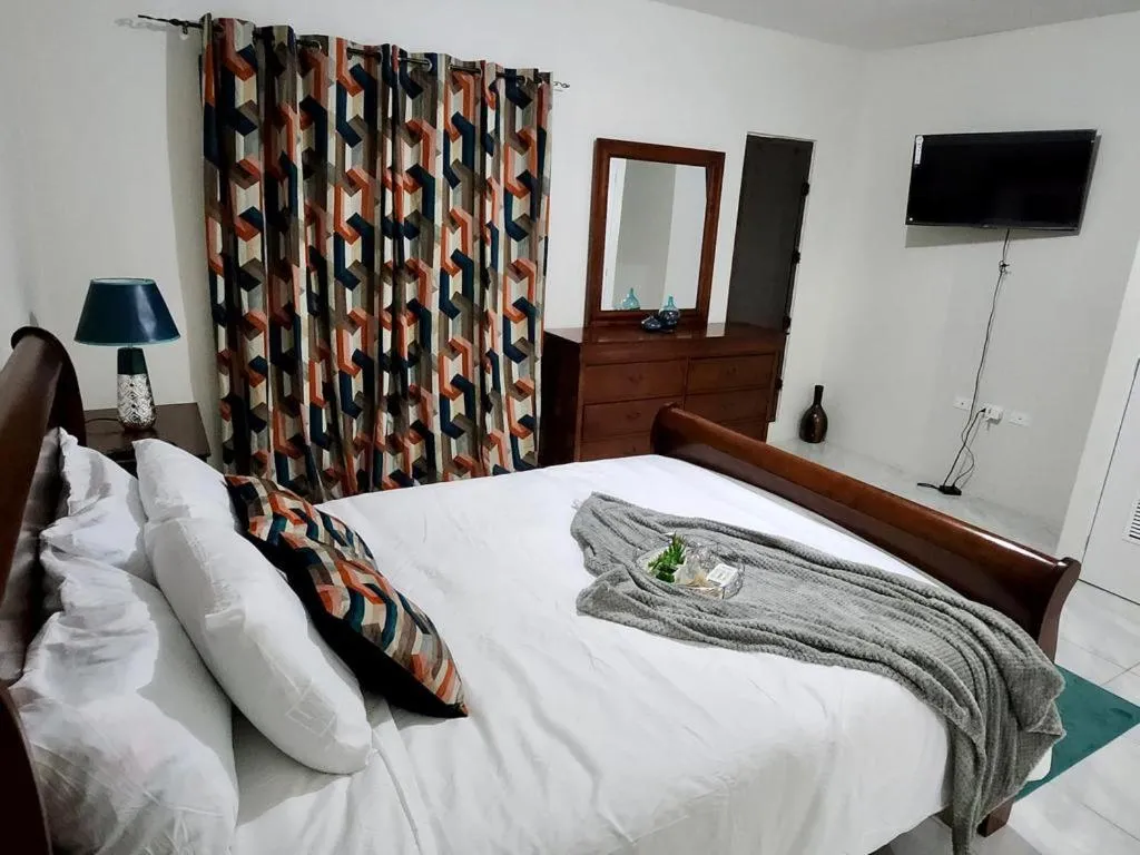 Bed in VaeTropicalParadise Free Puerto Seco Beach Access