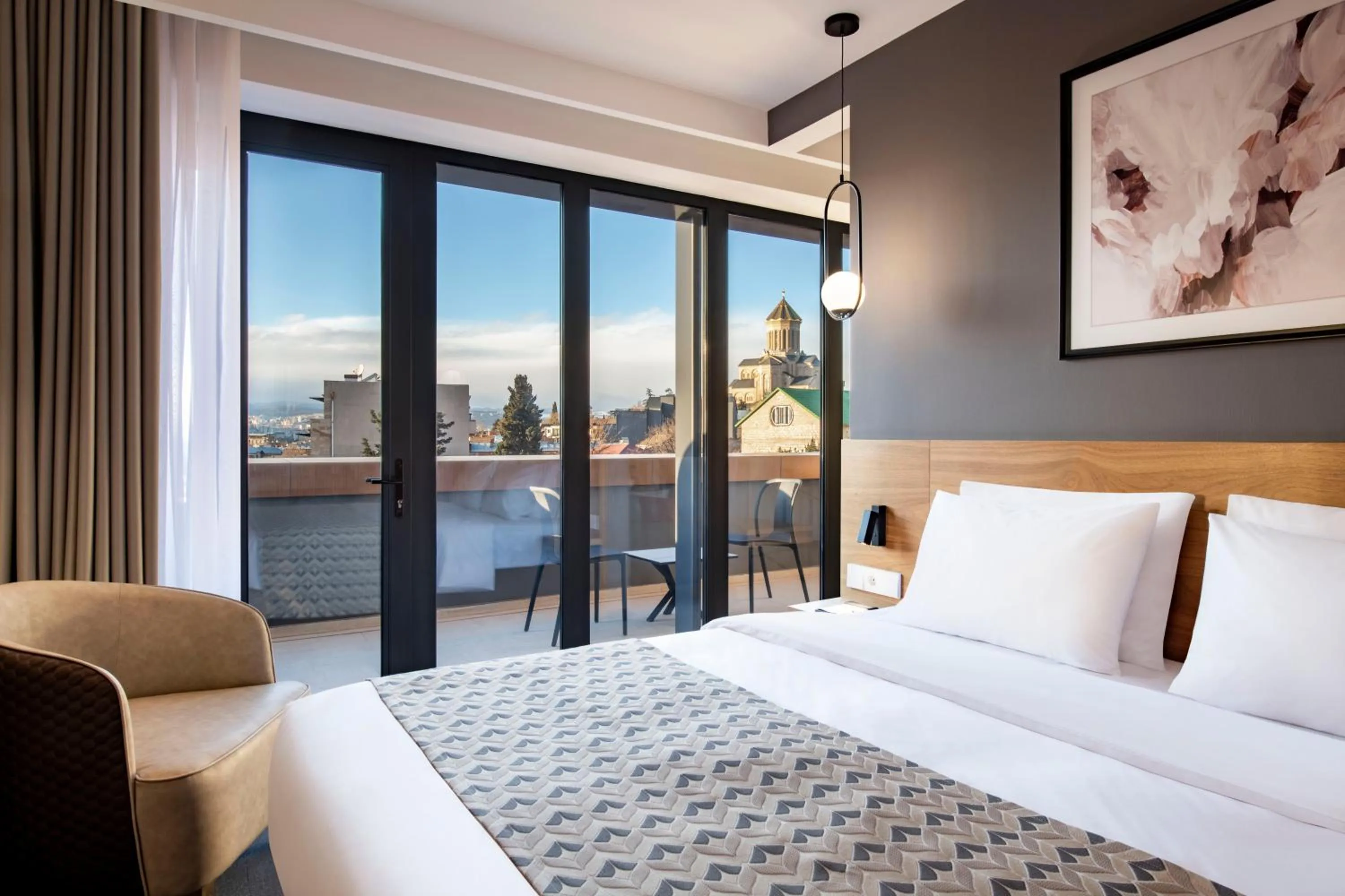 Bed in Clocks Hotel Tbilisi