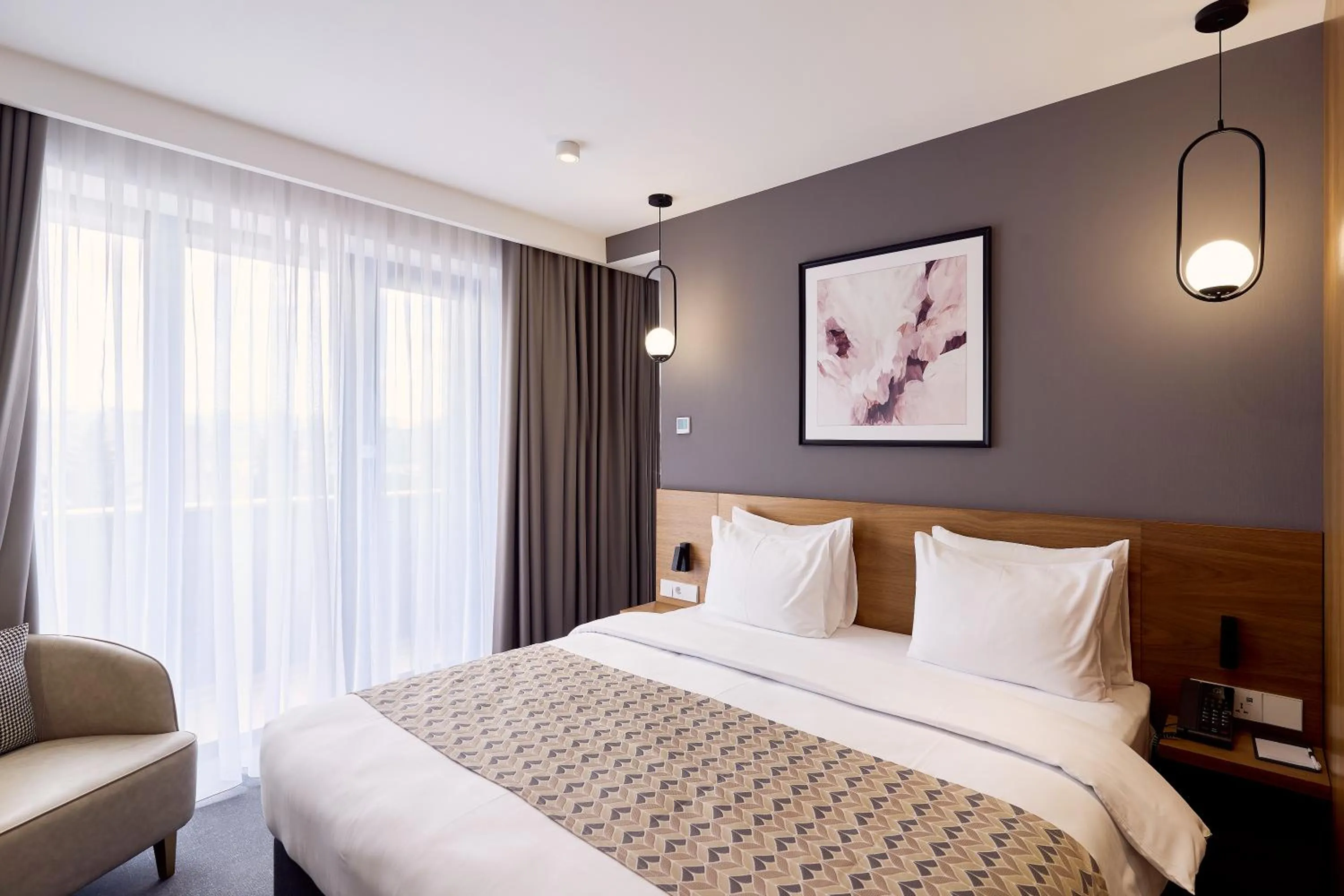 Bed in Clocks Hotel Tbilisi