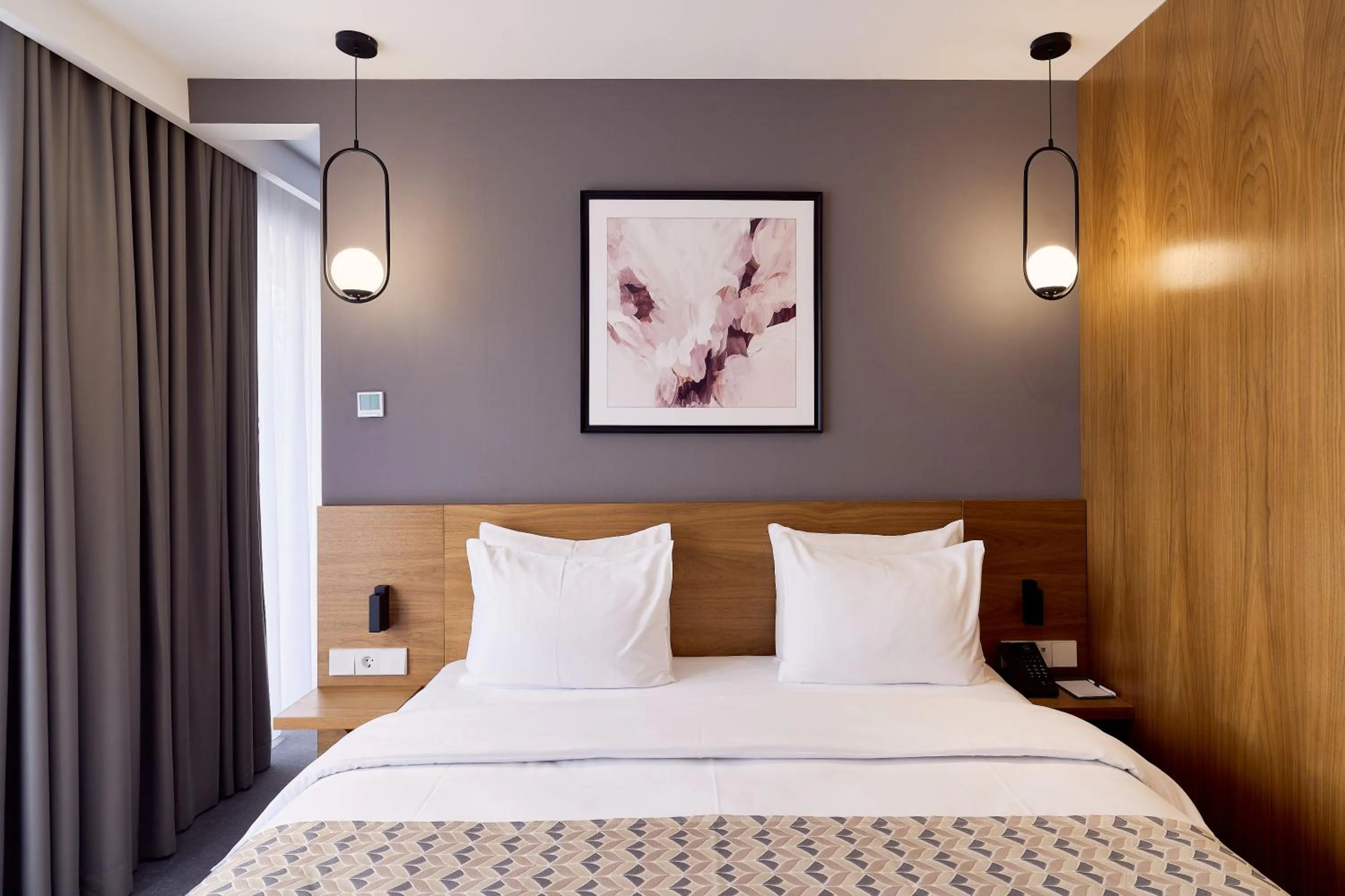 Bed in Clocks Hotel Tbilisi