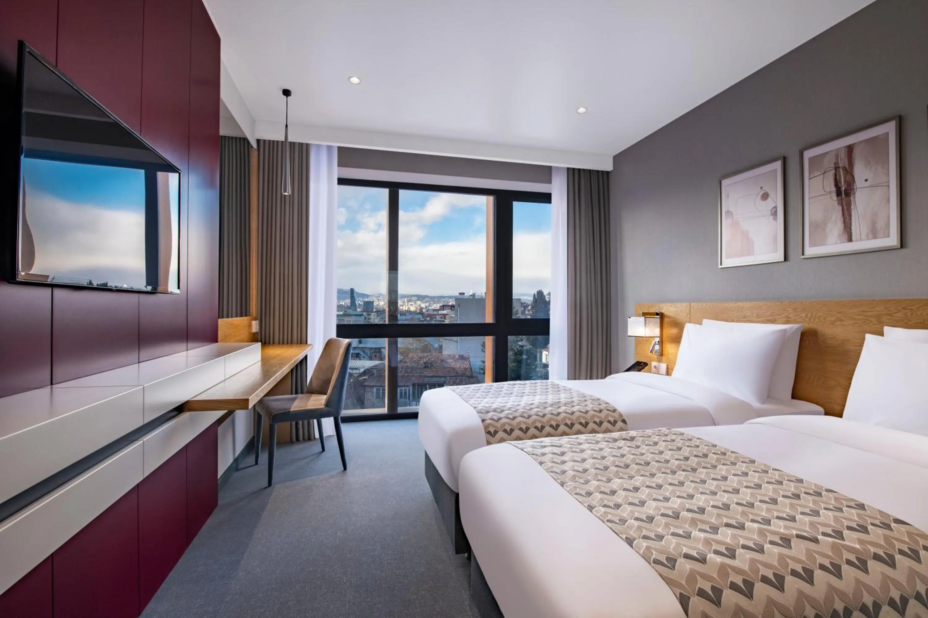 Bed in Clocks Hotel Tbilisi