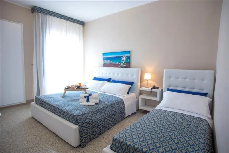 Bed in Hotel Lo Scoglio