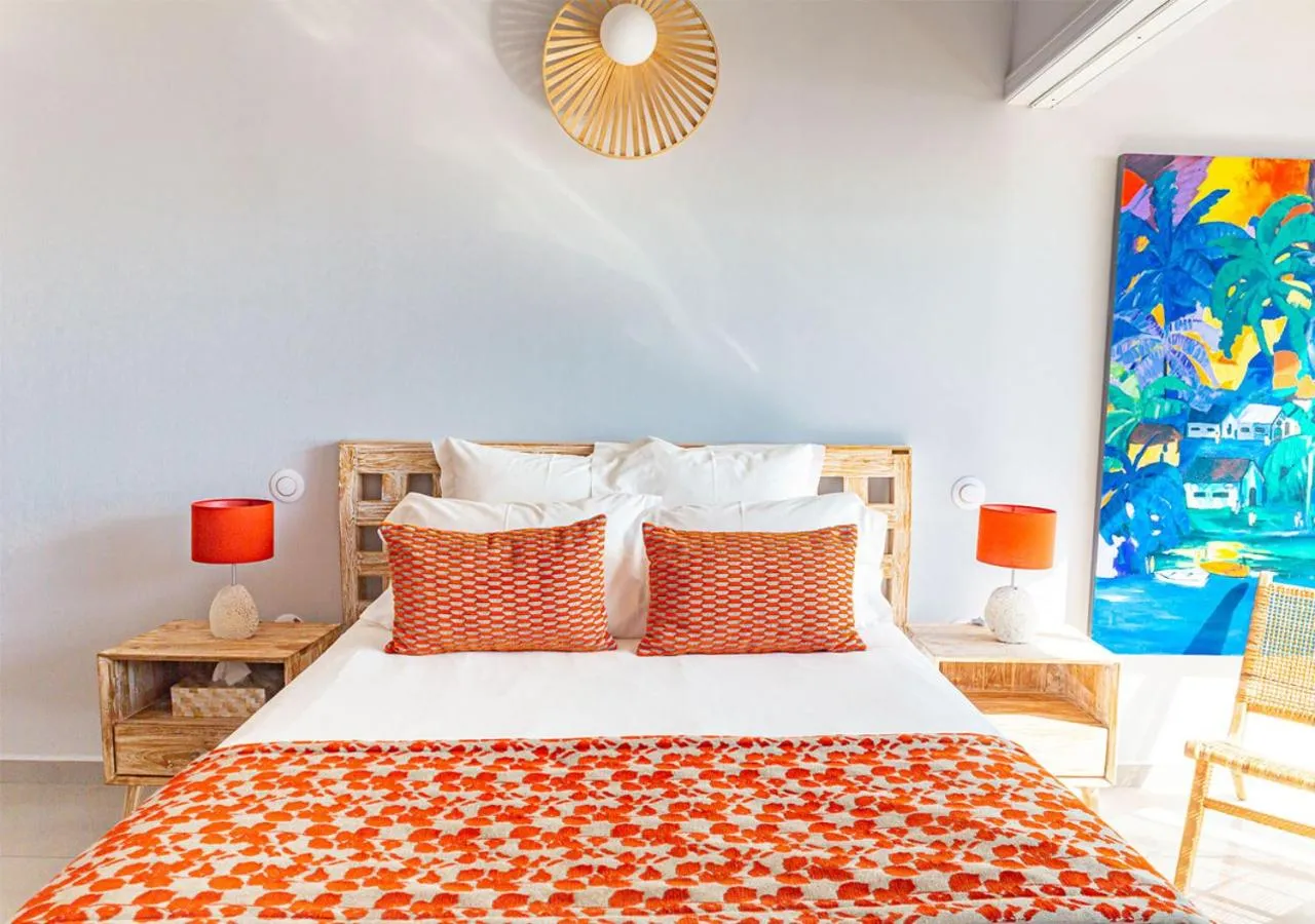 Bed in LES GALETS ROUGES LODGES & SPA