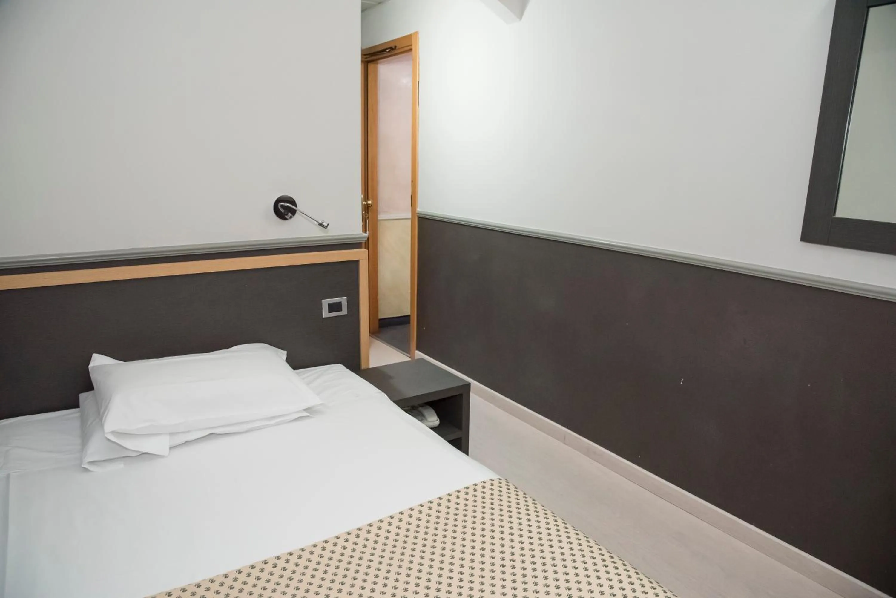 Bed in Hotel Corallo