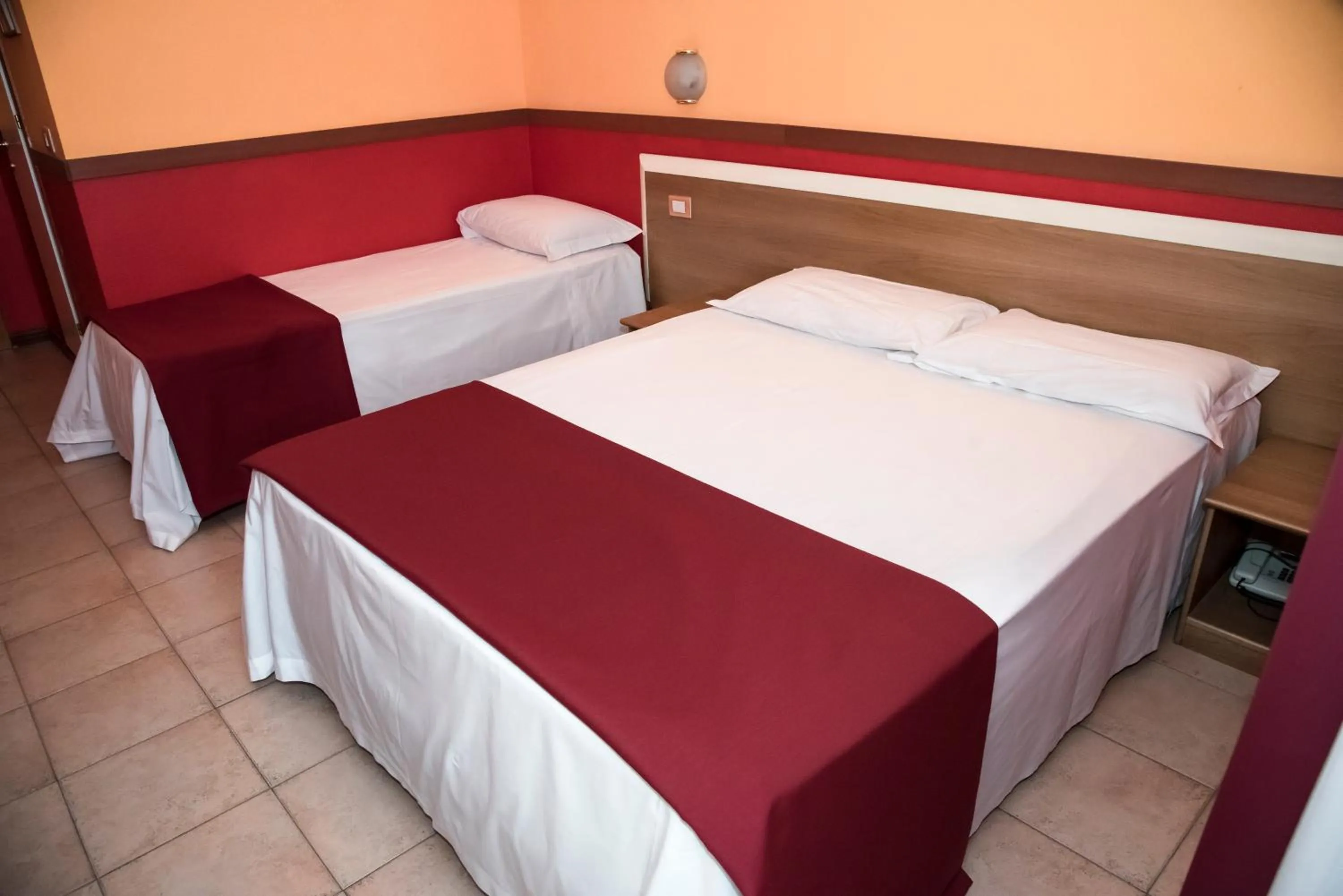 Bed in Hotel Corallo