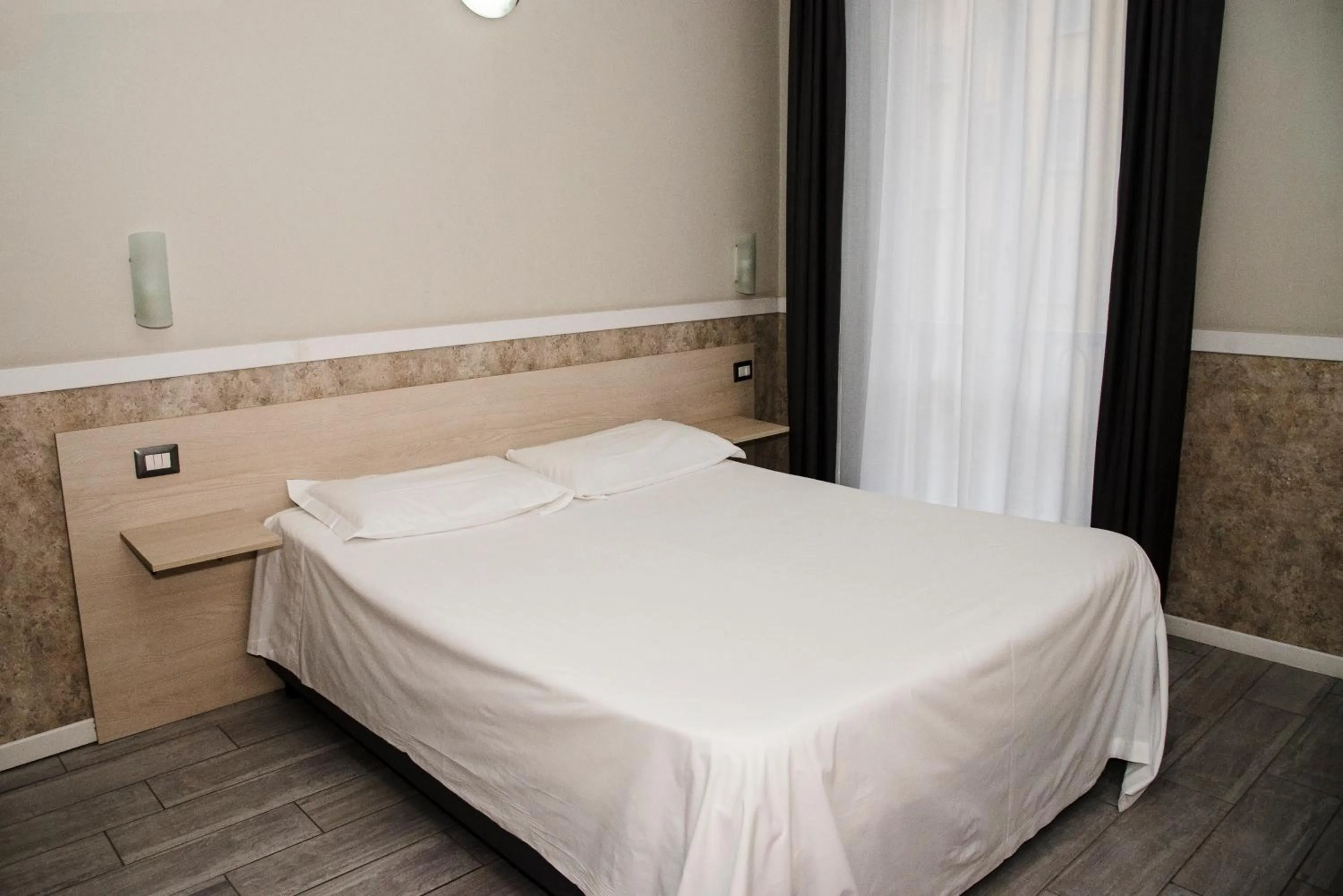 Bed in Hotel Corallo