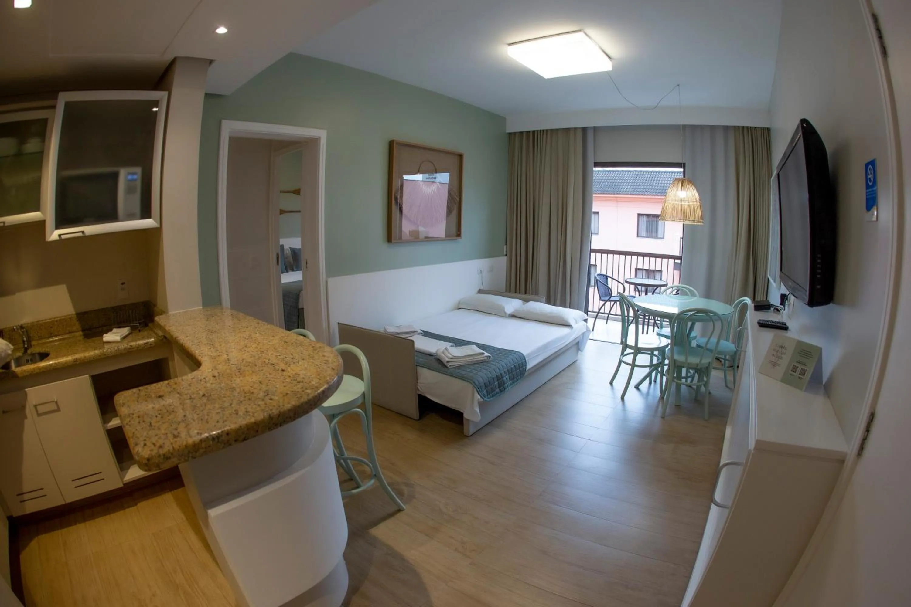 Living room, Bed in Jurerê Beach Village - Suíte