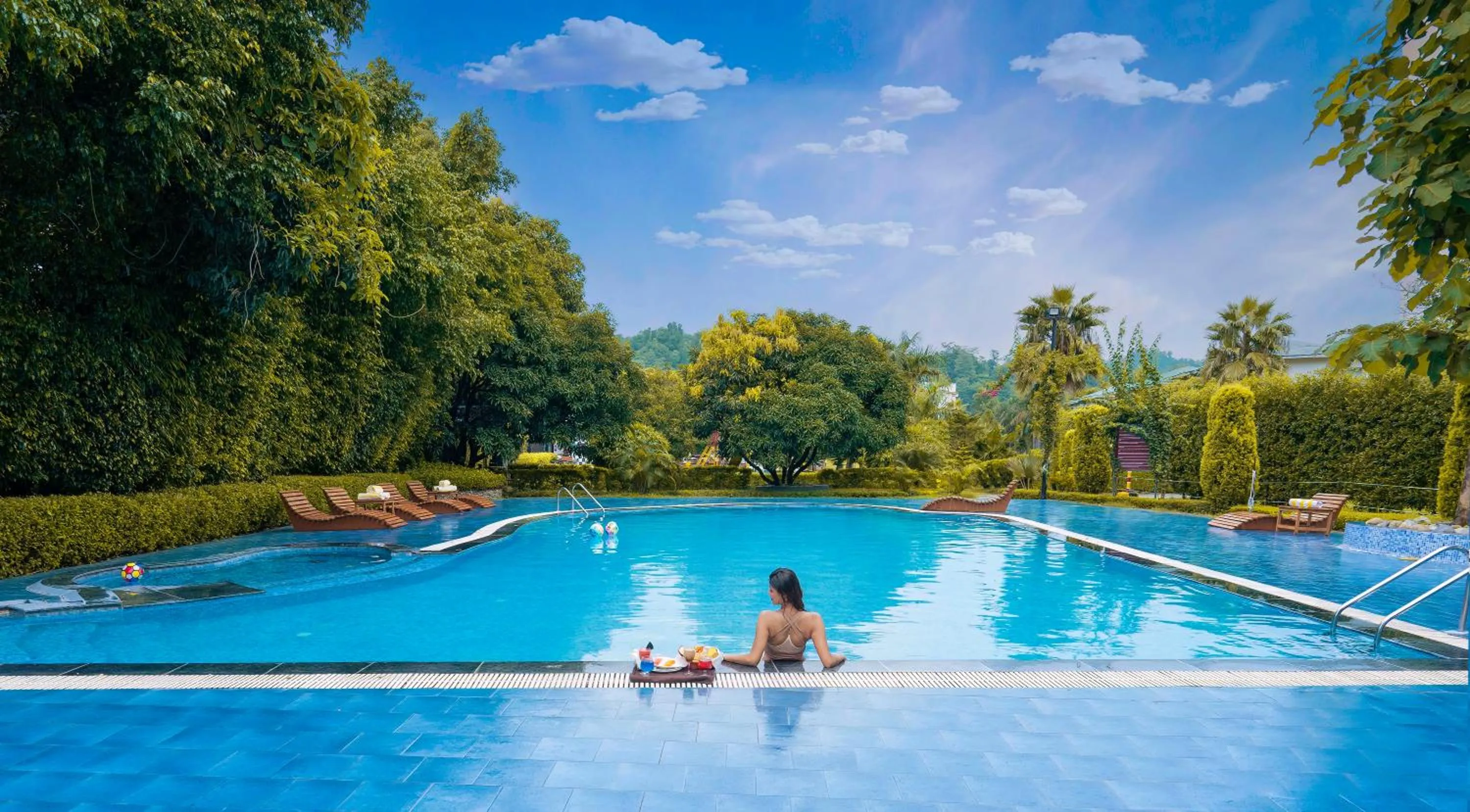 Swimming pool in The Tattwaa Corbett Spa and Resort