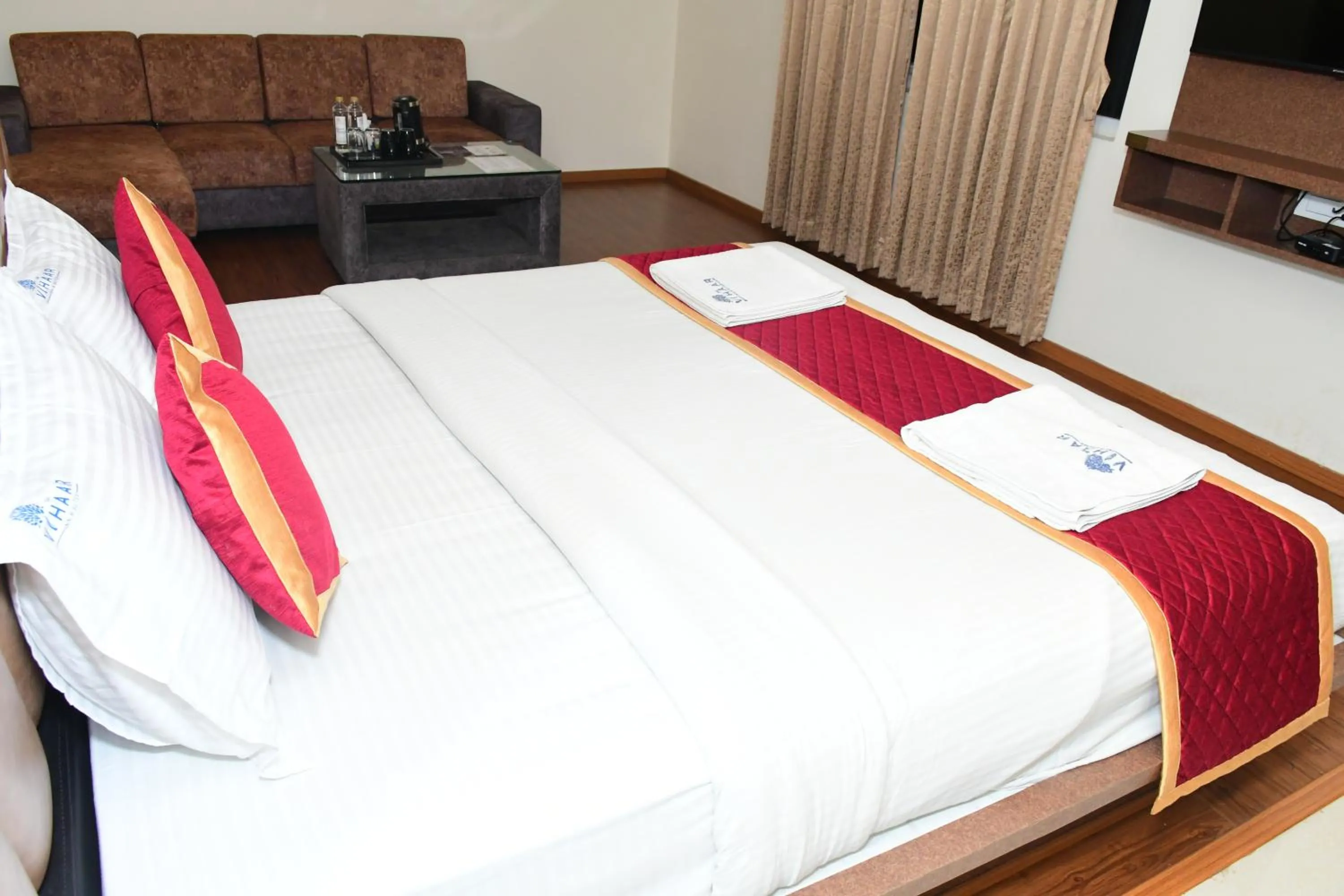 Photo of the whole room, Bed in Sai Vihaar Inn & Suites