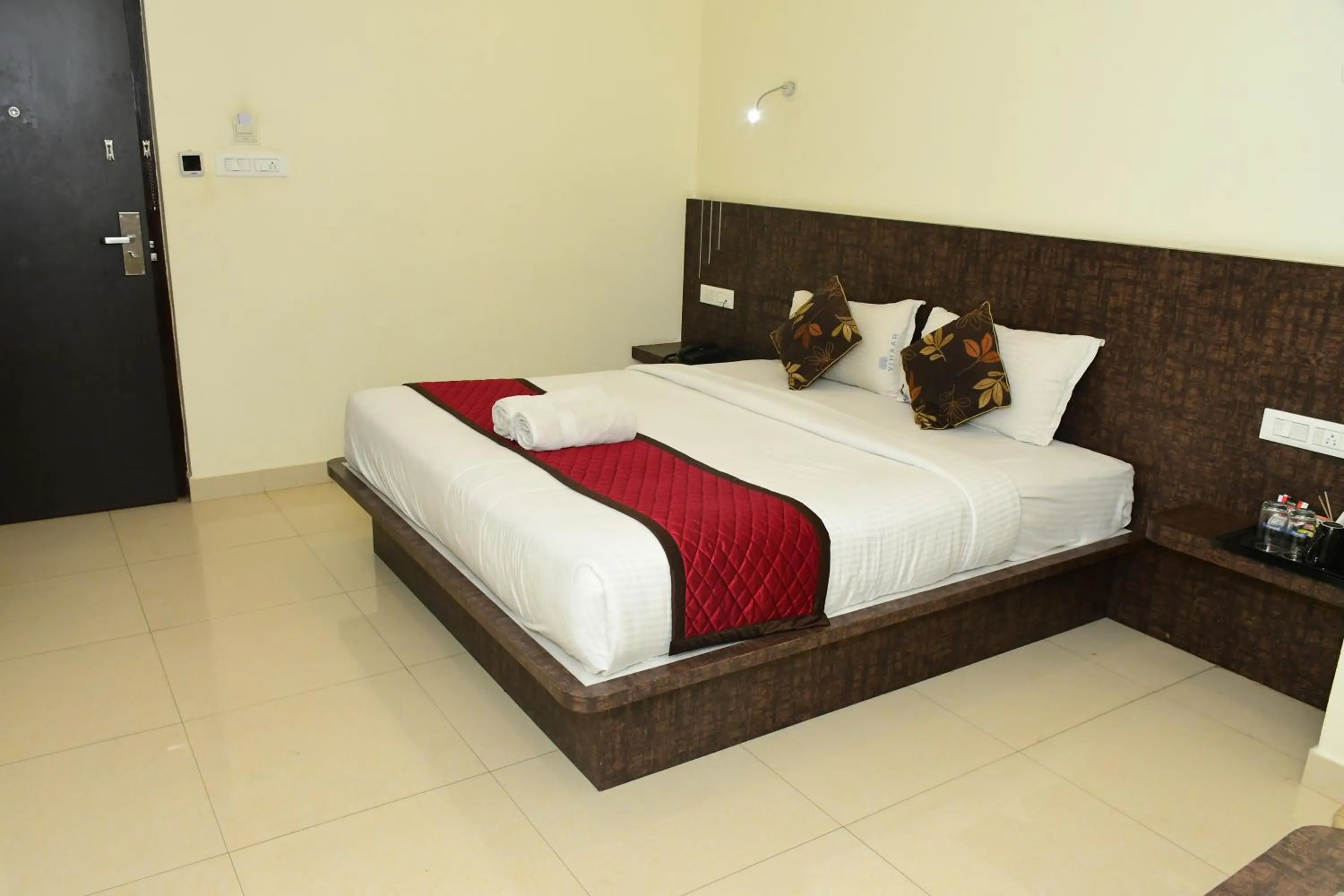 Photo of the whole room, Bed in Sai Vihaar Inn & Suites
