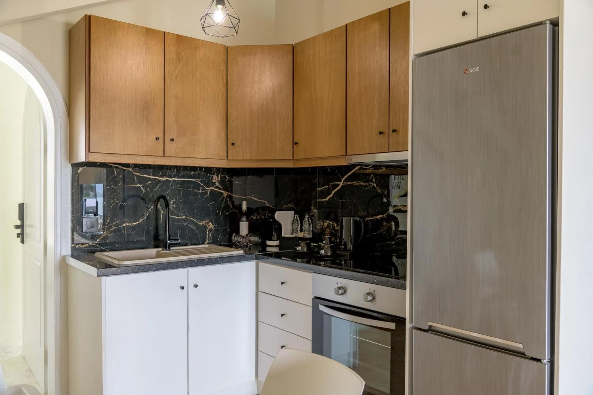 Kitchen or kitchenette in Nikon Boutique Hotel