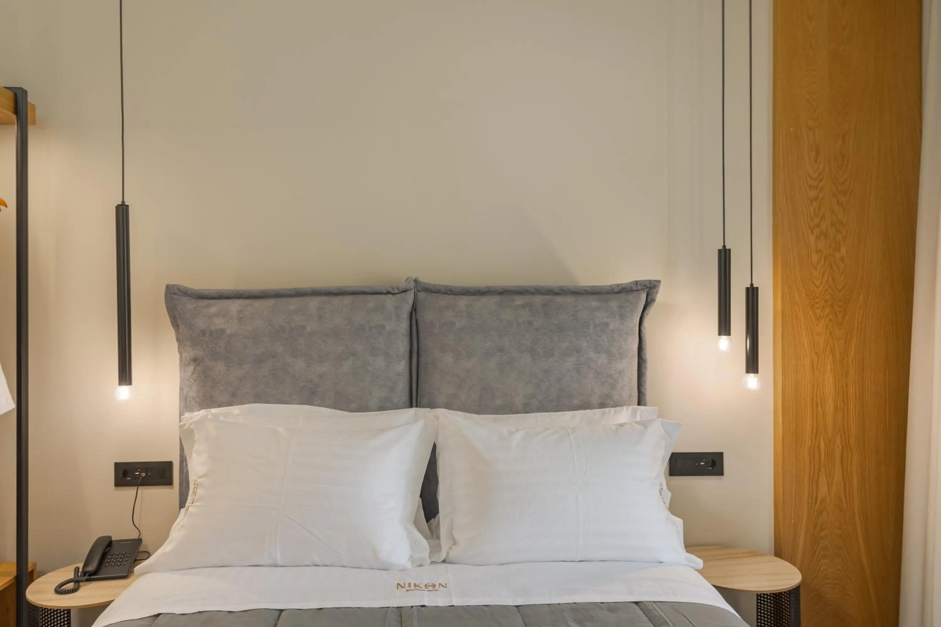 Bed in Nikon Boutique Hotel