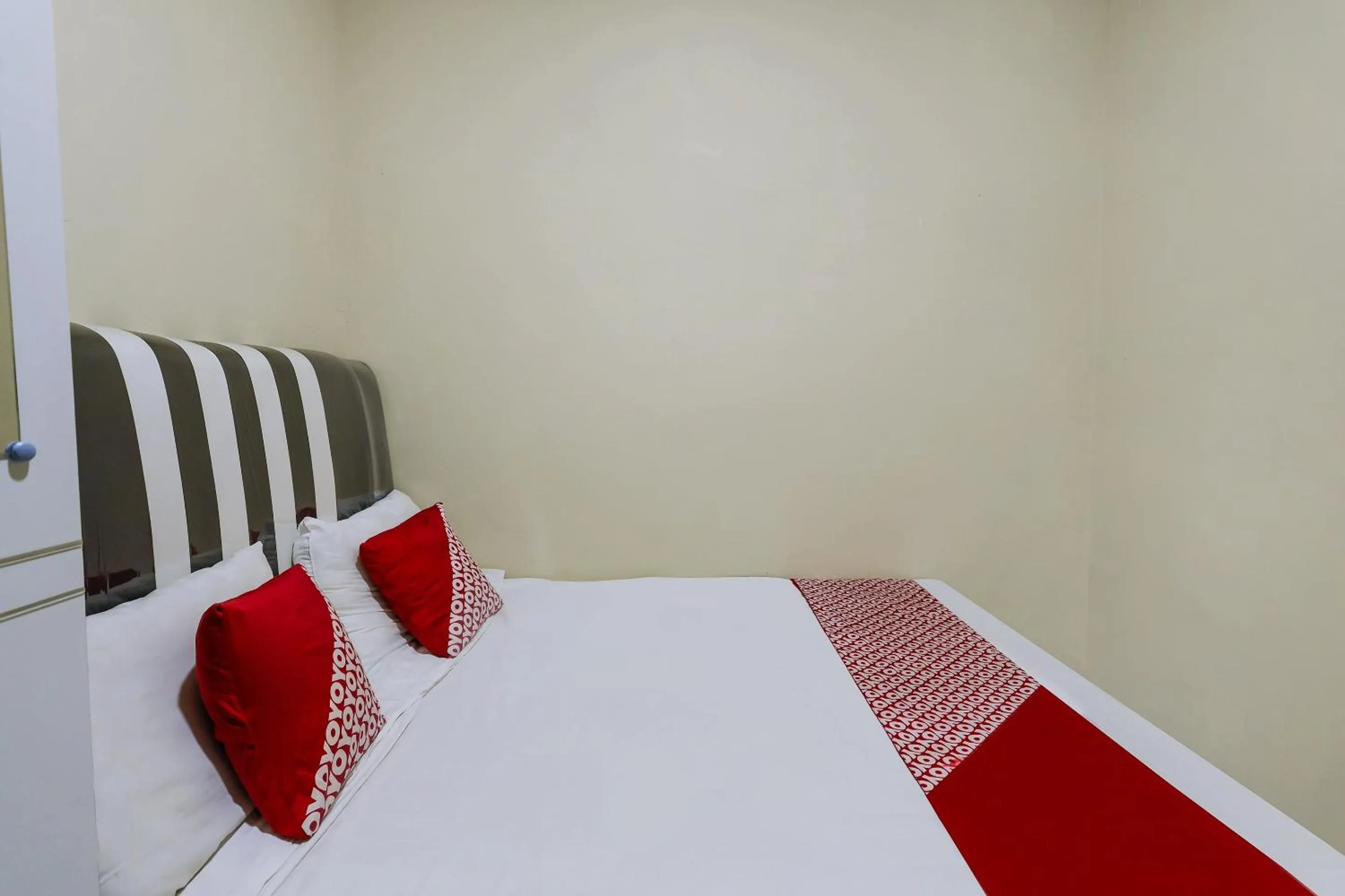 Bedroom in Hotel O X2 Homestay