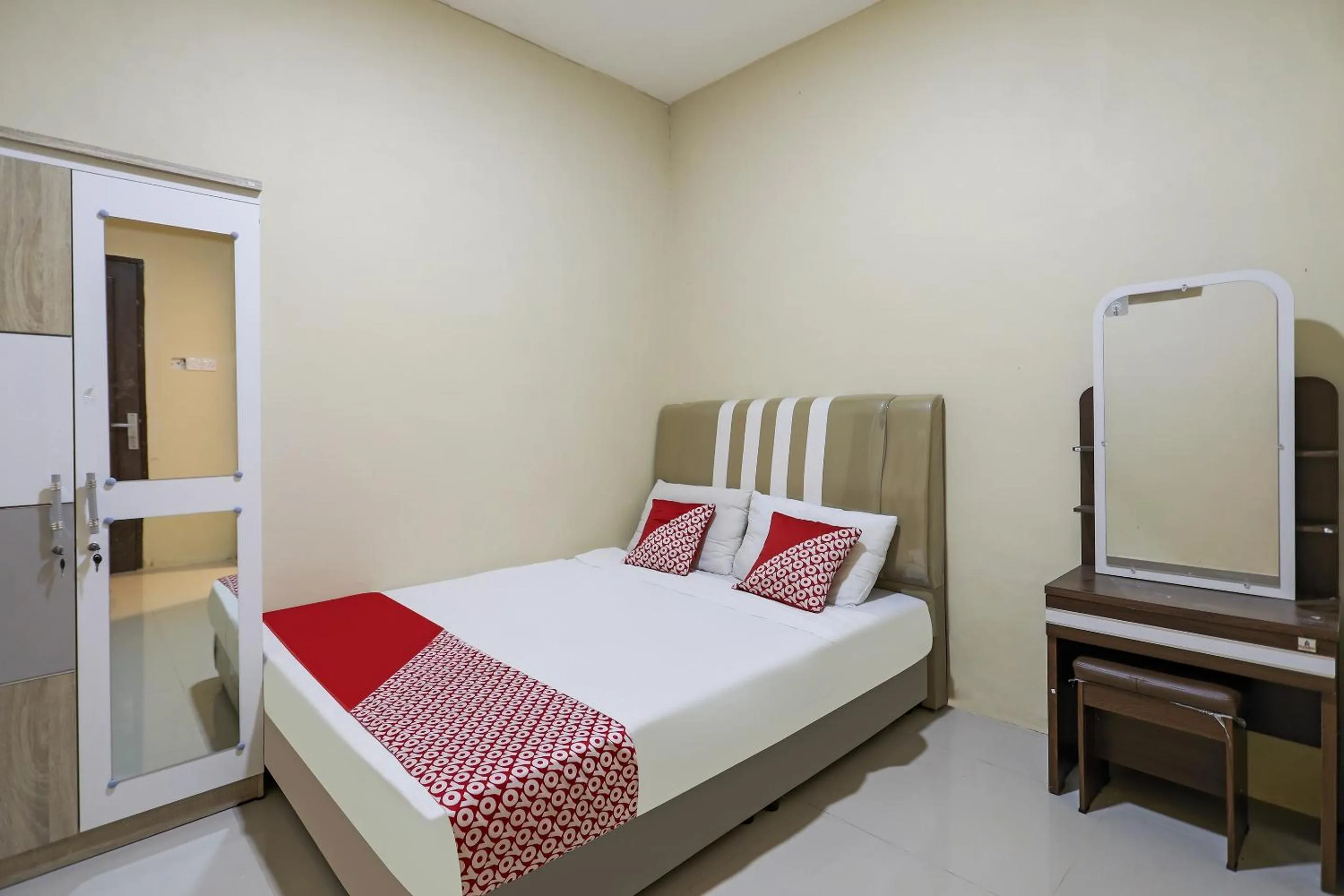 Bedroom in Hotel O X2 Homestay