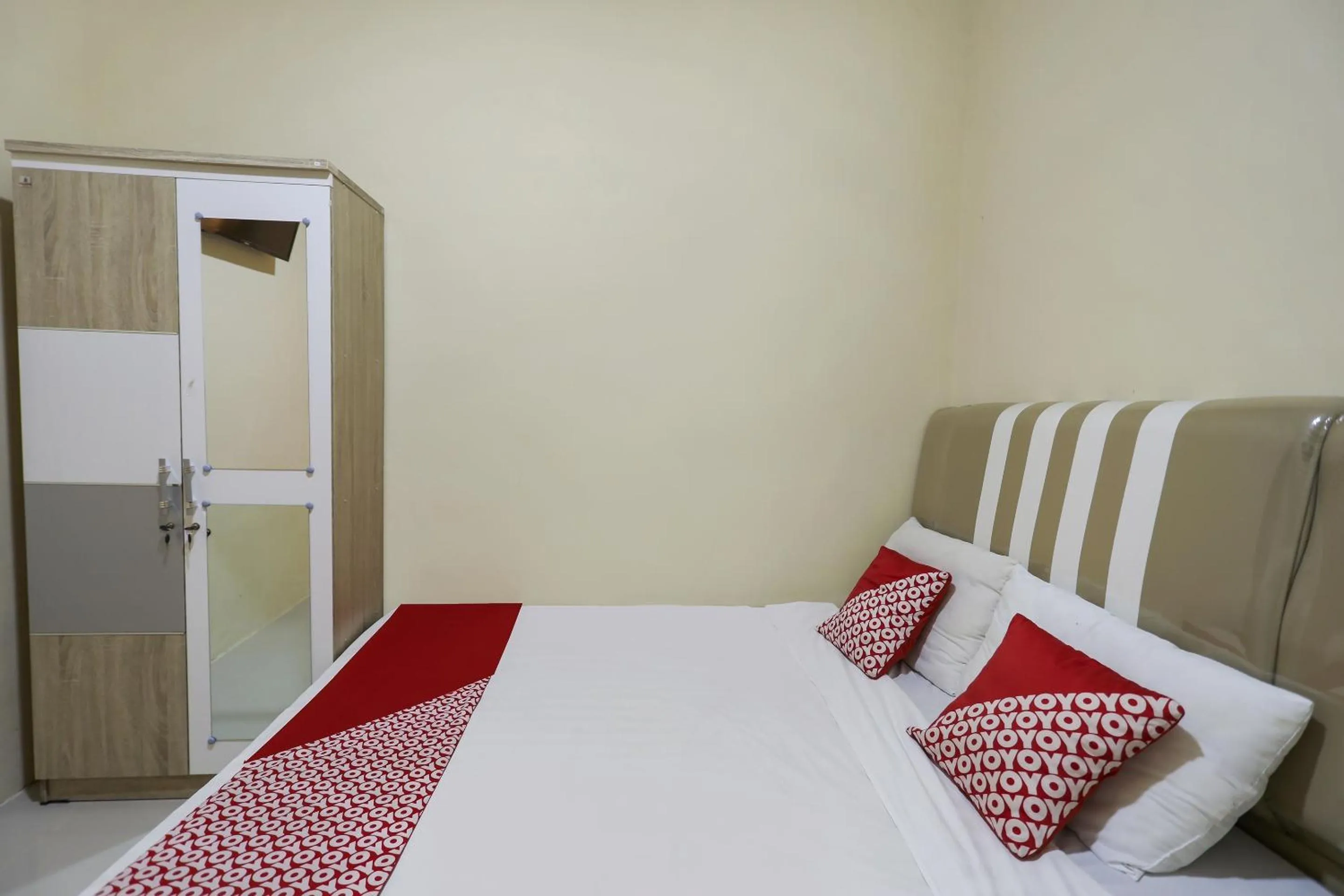 Bedroom in Hotel O X2 Homestay