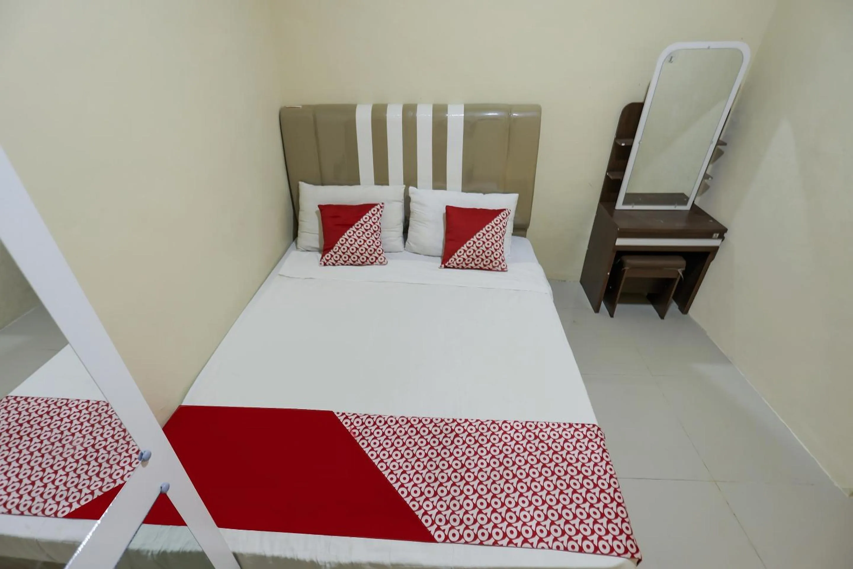 Bedroom in Hotel O X2 Homestay