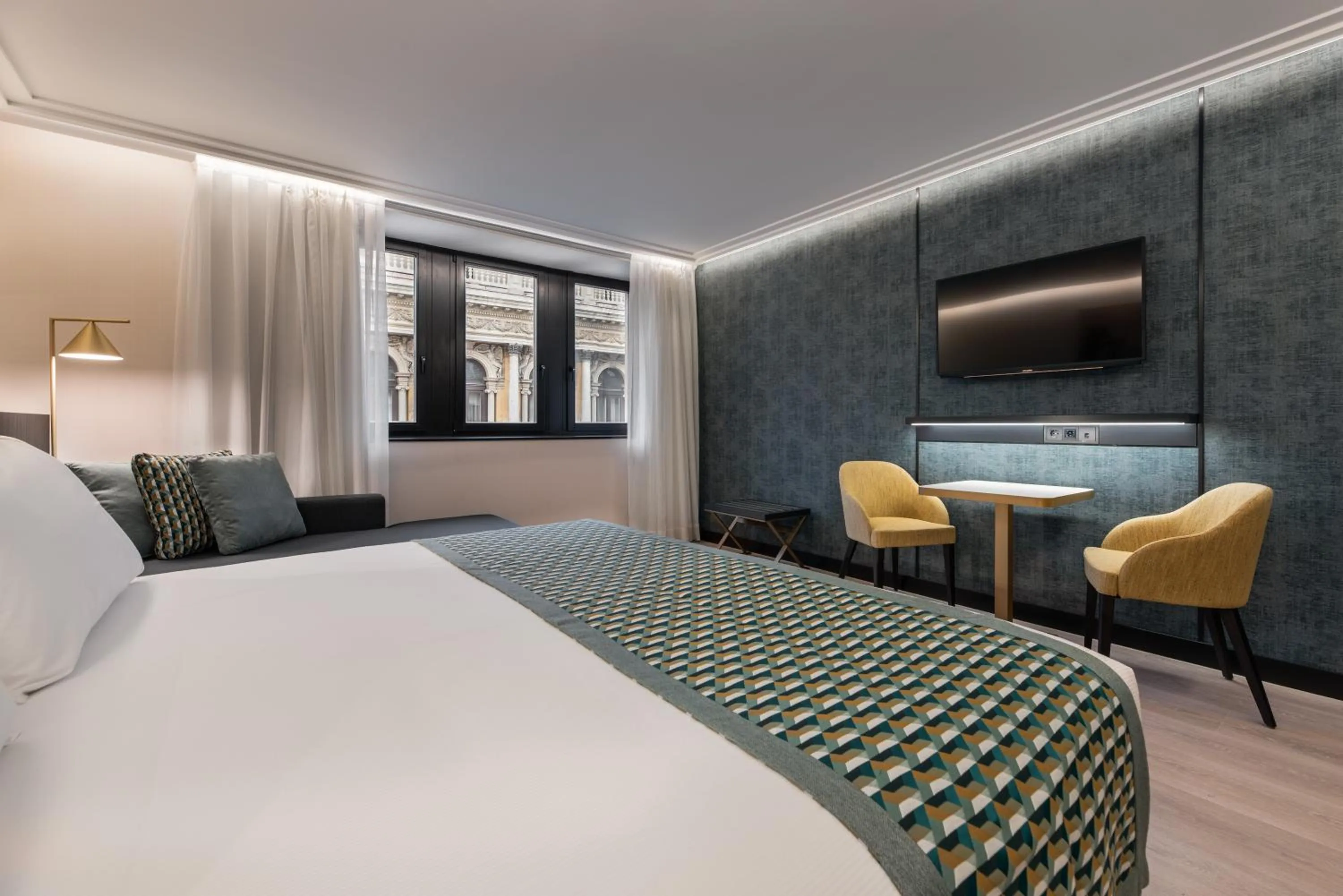 Bed in Eurostars Ambassador