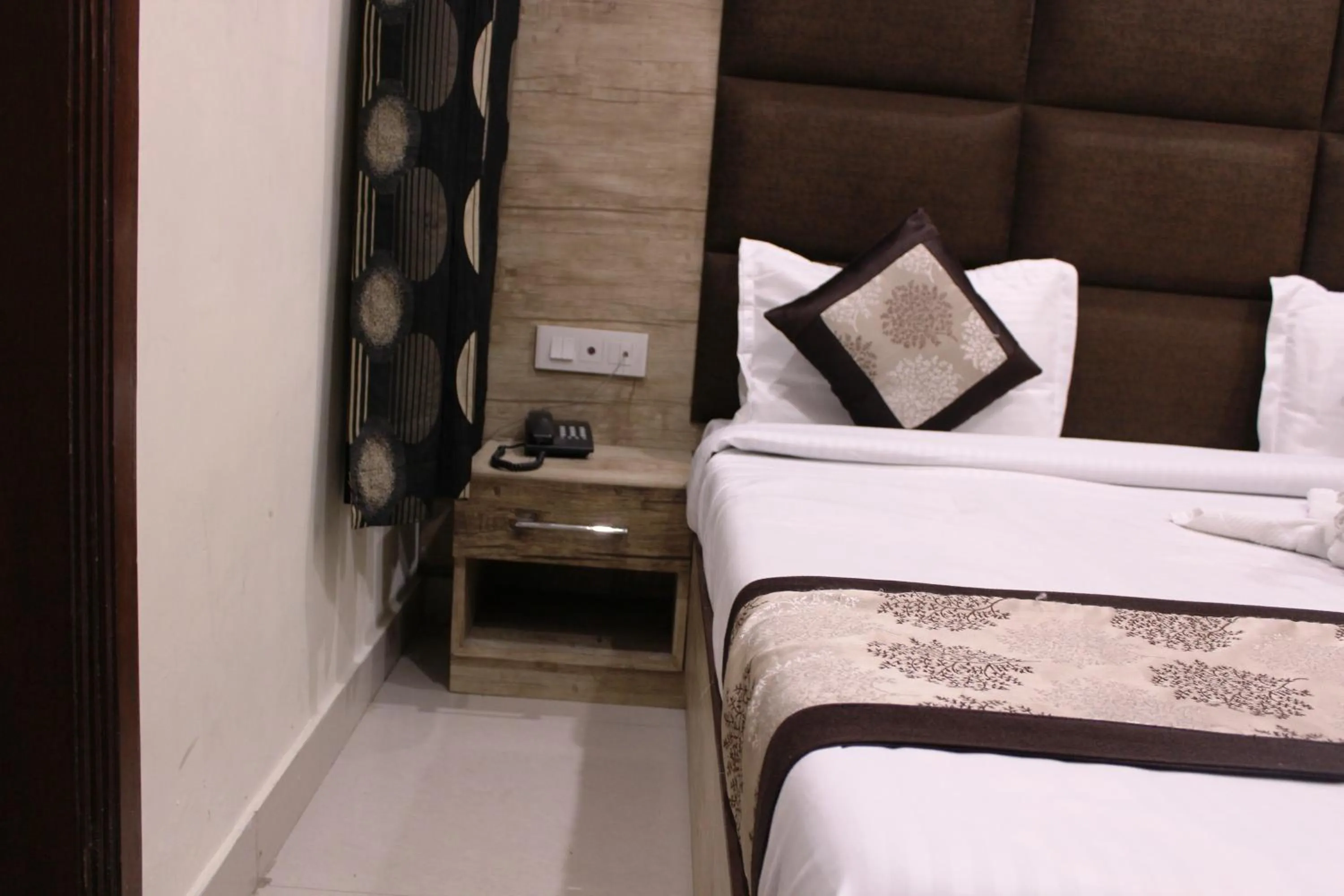 Bed in Shree Krishna Hotels