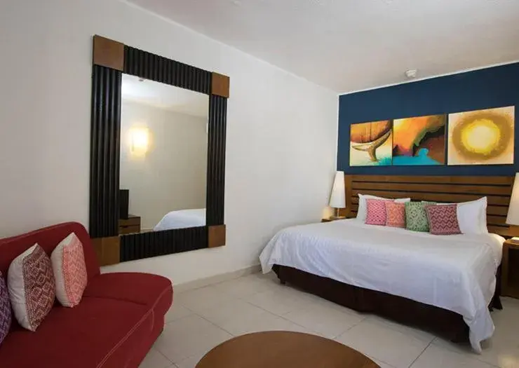 Bed in Grand Decameron Los Cabos, A Trademark All-Inclusive Resort Bed in Grand Decameron Los Cabos, A Trademark All-Inclusive Resort
