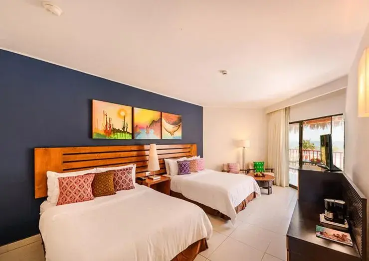 Bed in Grand Decameron Los Cabos, A Trademark All-Inclusive Resort Bed in Grand Decameron Los Cabos, A Trademark All-Inclusive Resort