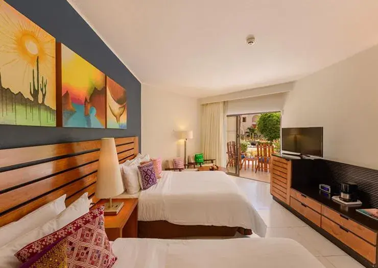 Bed in Grand Decameron Los Cabos, A Trademark All-Inclusive Resort Bed in Grand Decameron Los Cabos, A Trademark All-Inclusive Resort